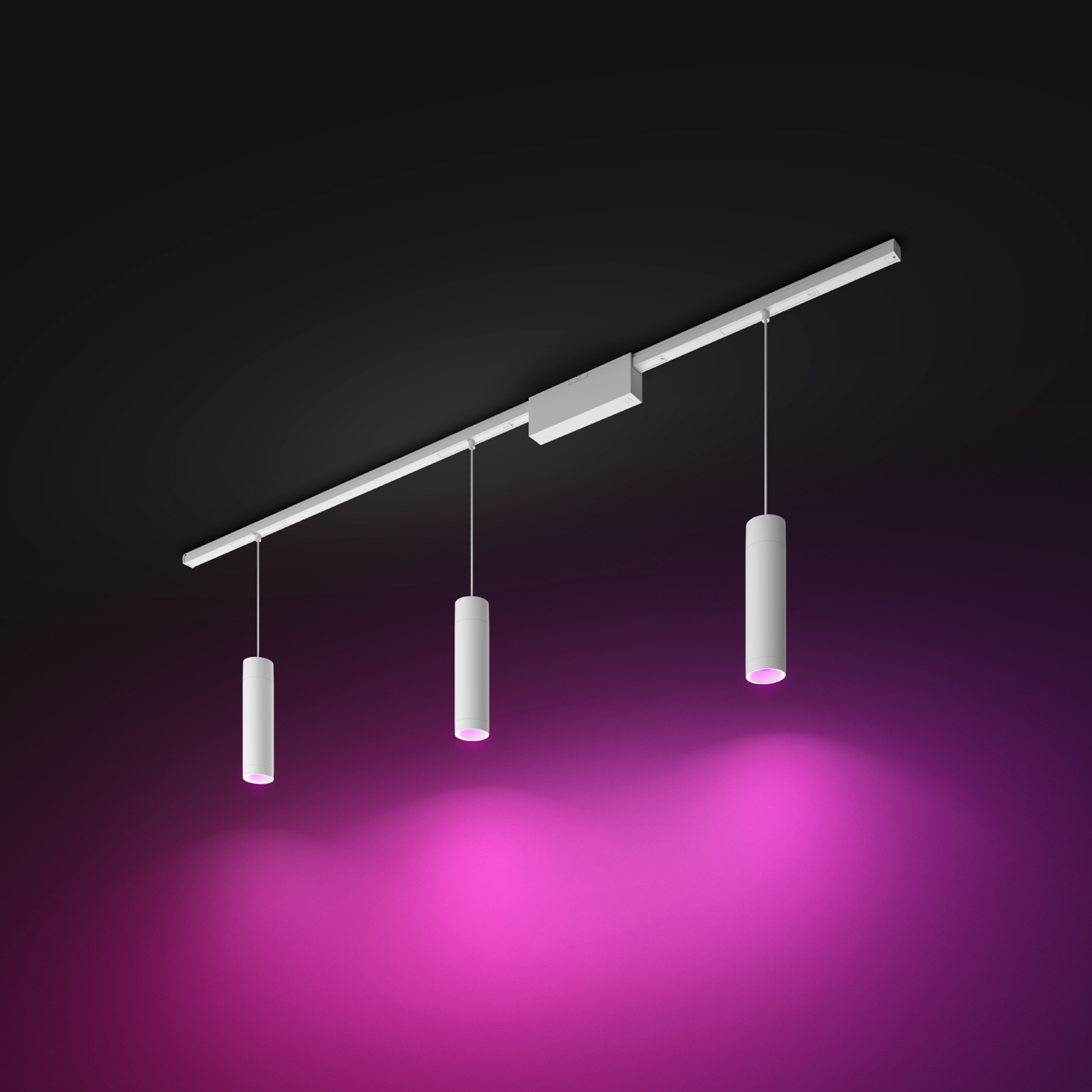 Trois lumières cylindriques blanches suspendues à une piste. La scène est éclairée en rose.