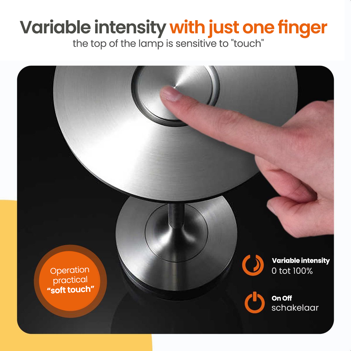 A person's finger touches a silver lamp with a touch-sensitive top. The lamp is on.