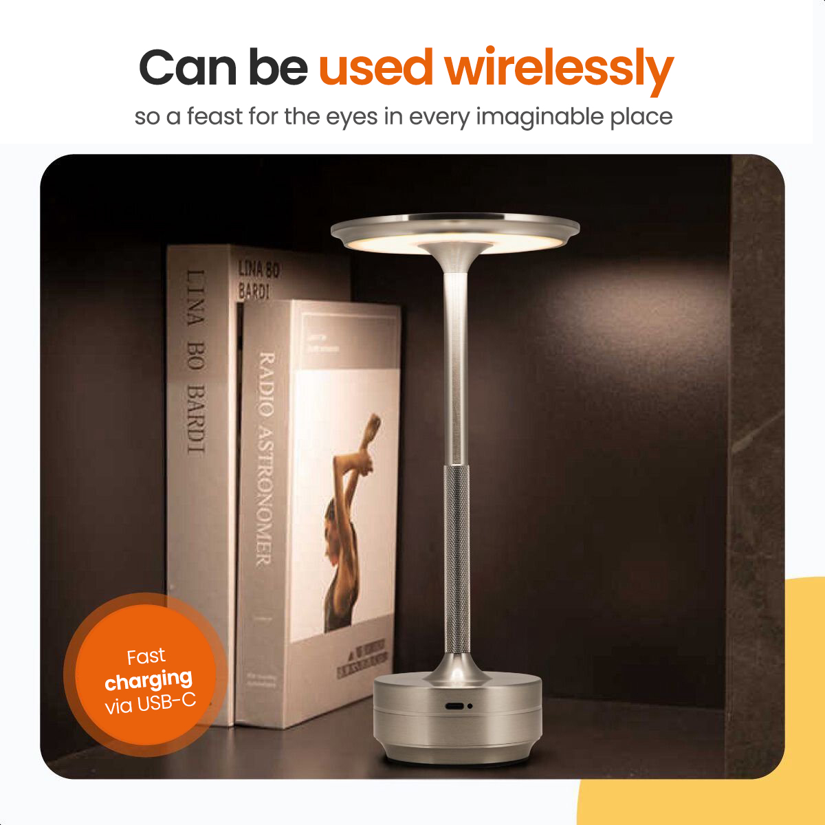A silver table lamp next to books, with the text "Can be used wirelessly". A orange charging mark is on the left.