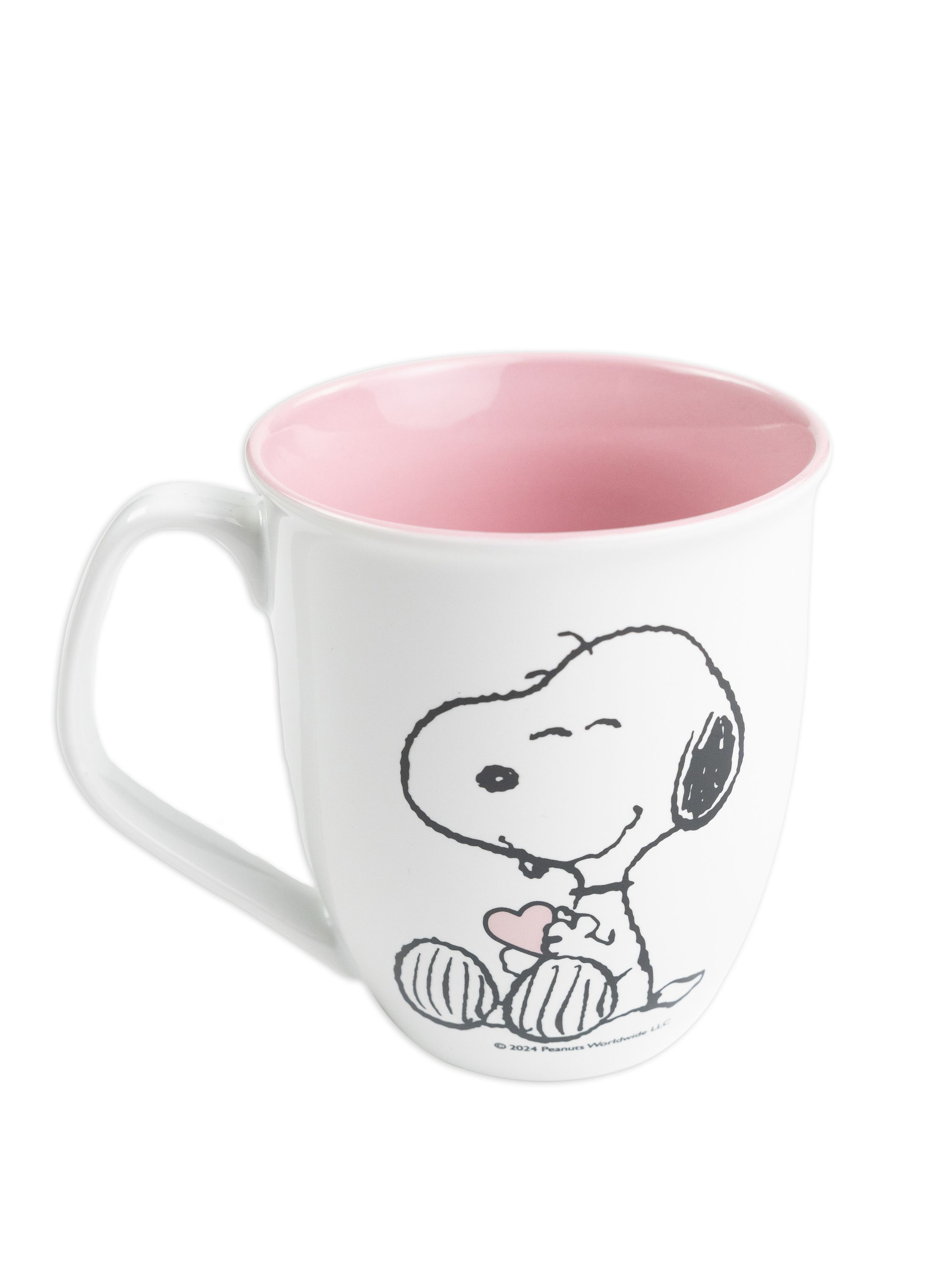Eine weiße Tasse mit Snoopy-Cartoon-Design. Der Innenraum ist rosa.