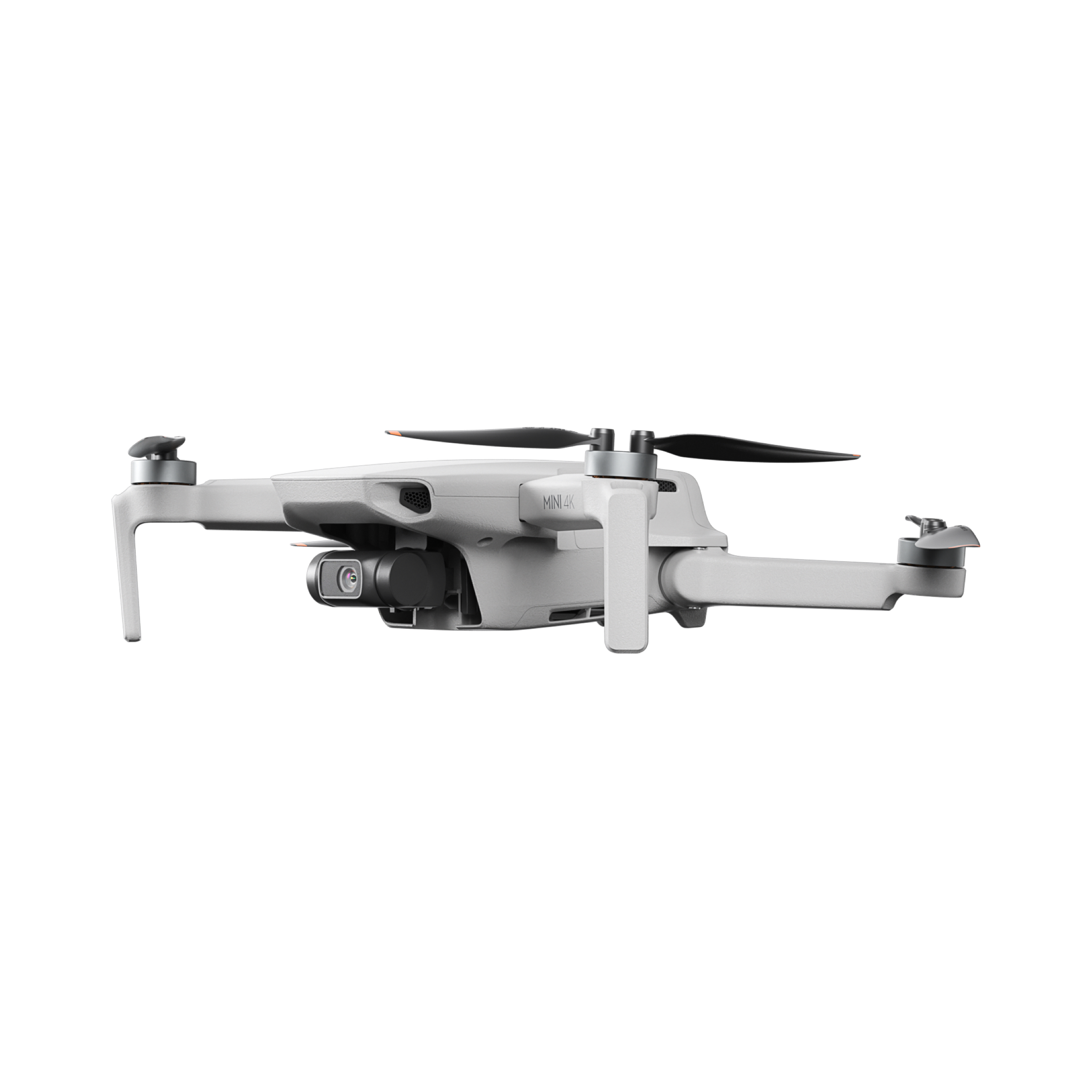 Eine weiße und graue DJI Mini 2 Drohne, aus einem niedrigen Winkel betrachtet, mit Propellern und Kamera.