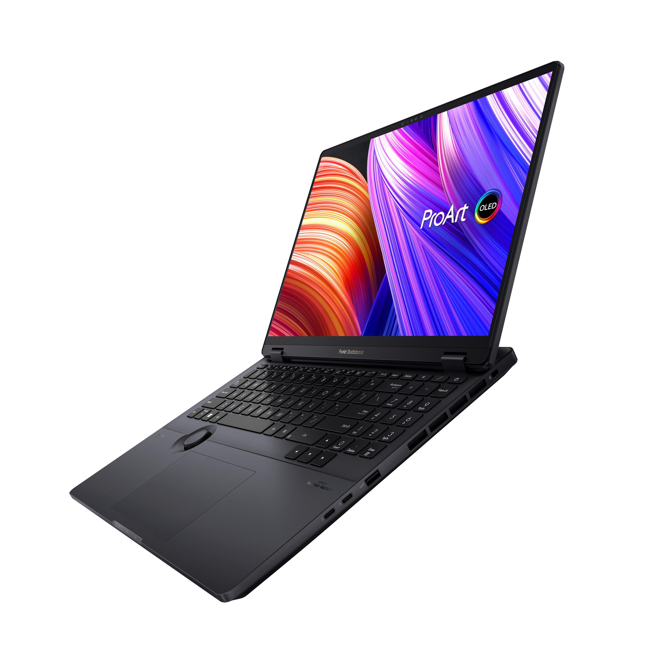 Schwarzer Laptop mit offenem Bildschirm. Asus ProArt OLED. Farbenfrohes Display. Schwarzer Rahmen. Winkelansicht.