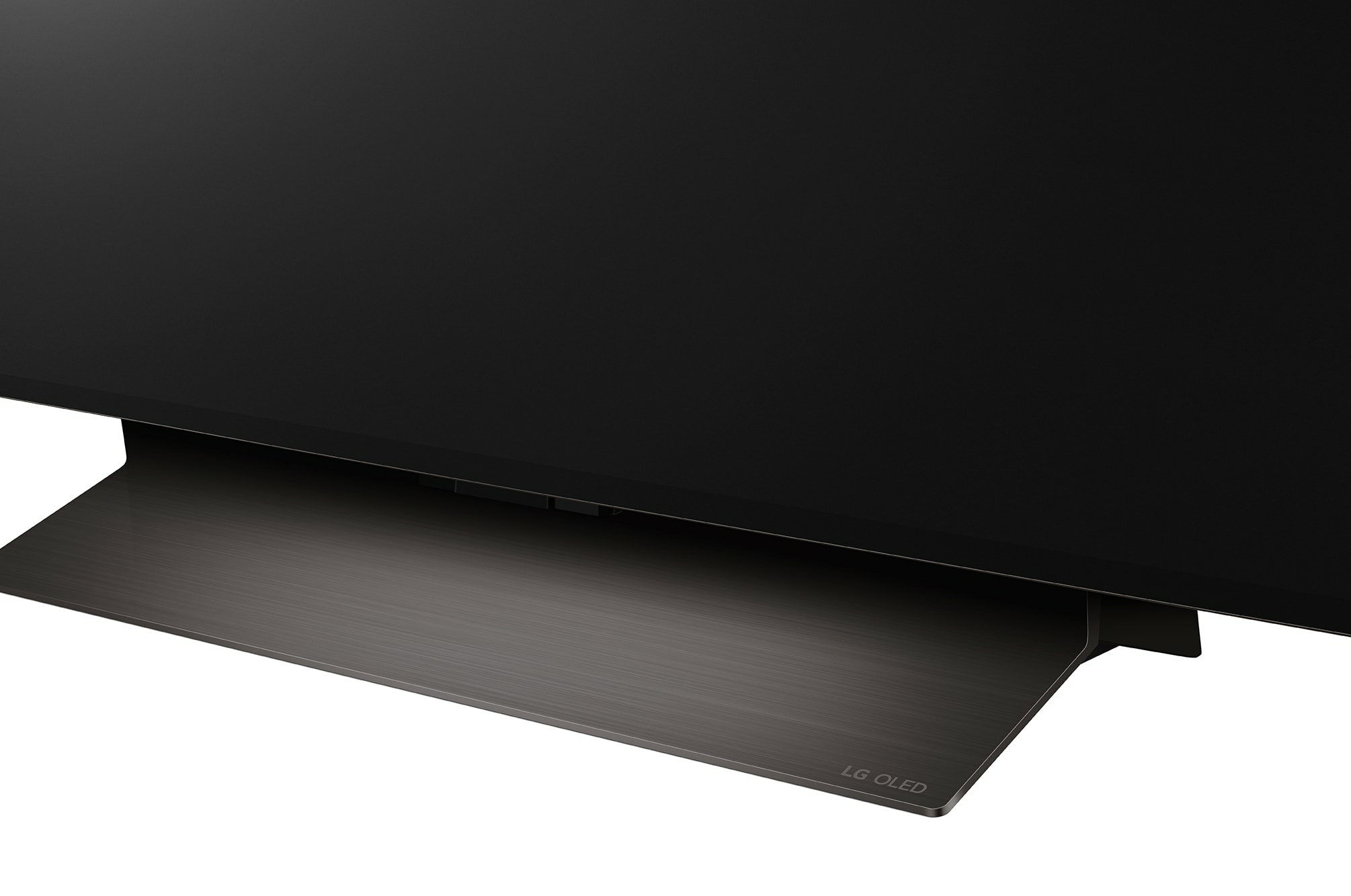 Soporte de TV negro con logo LG OLED, pantalla negra, fondo oscuro.