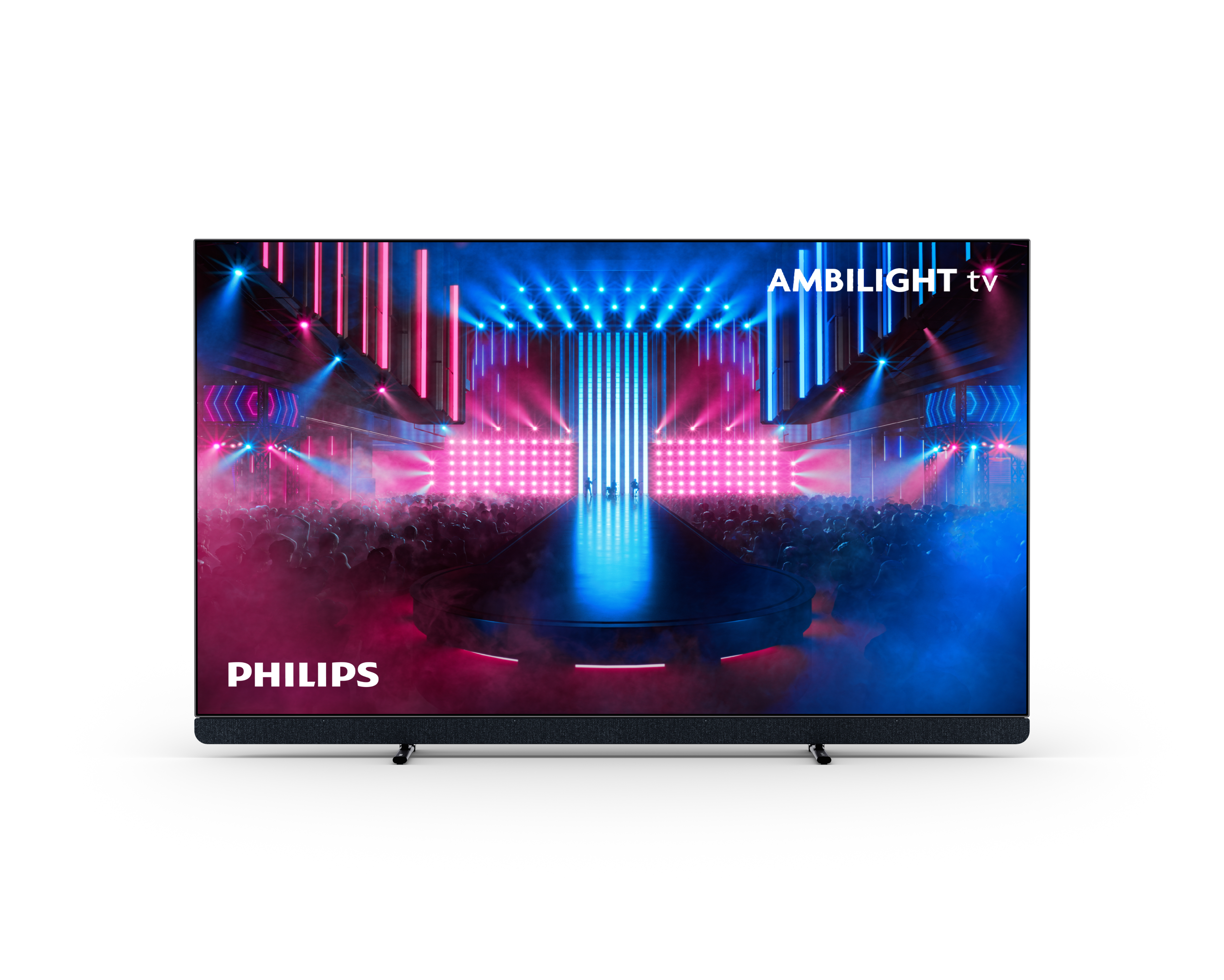 Telewizor Philips Ambilight wyświetla scenę z różowymi i niebieskimi światłami, z publicznością. Telewizor stoi na stojaku.
