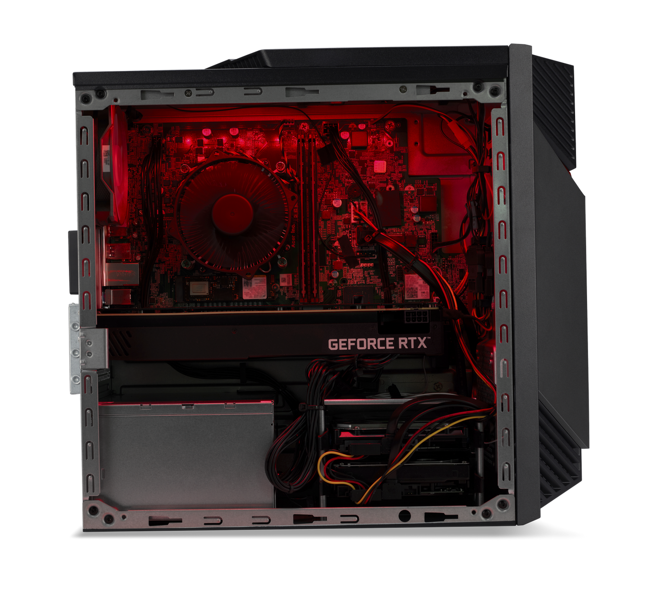 Dentro de una computadora, componentes iluminados por luz roja. Incluye un ventilador, una tarjeta gráfica y cables.