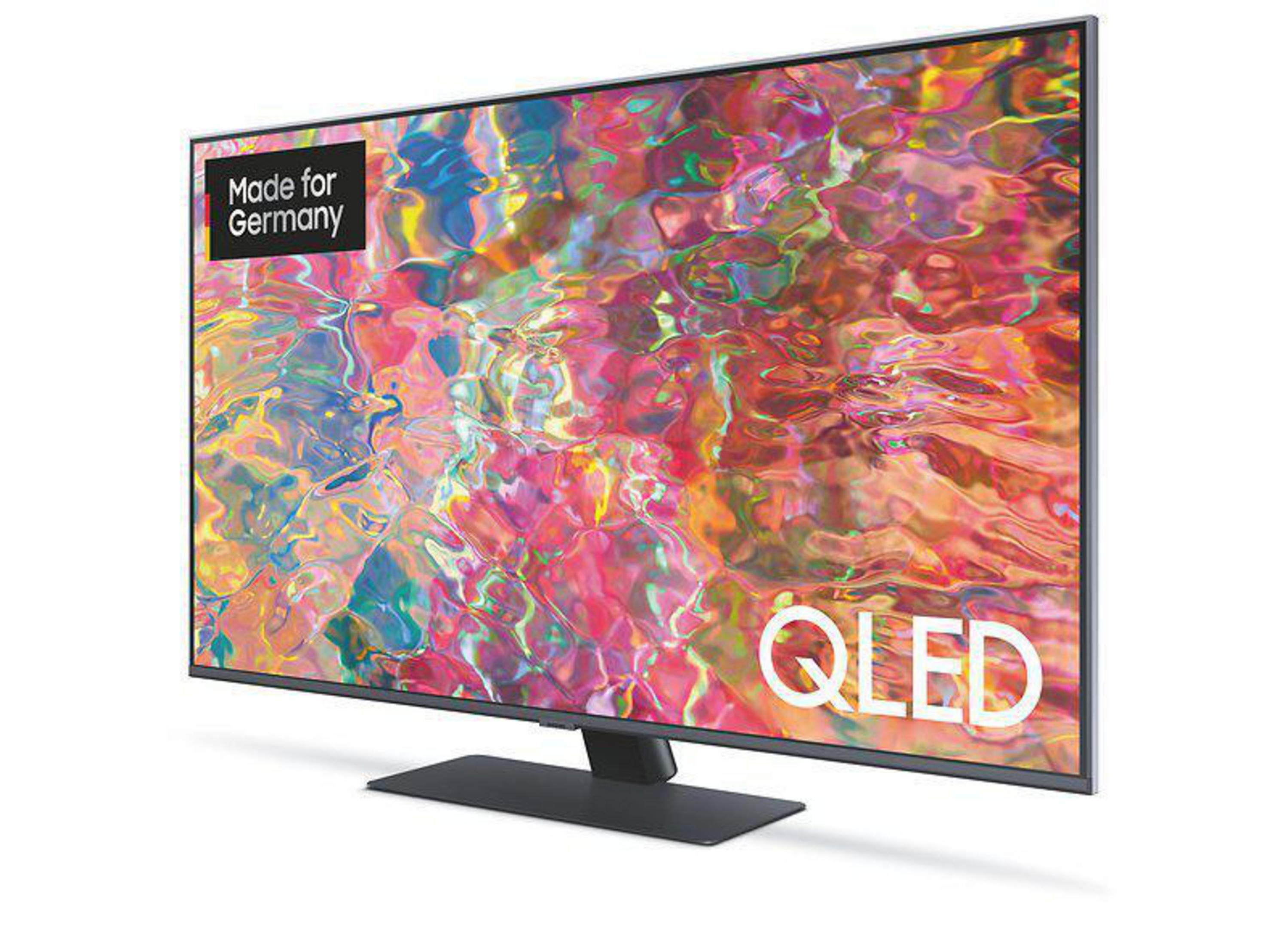 Telewizor QLED z kolorowym wyświetlaczem. Napis: 'Made for Germany' i 'QLED'.