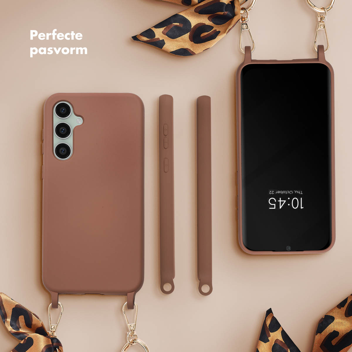 Custodia per telefono, due cinturini e un telefono. Colore marrone. Sciarpa con stampa leopardata.
