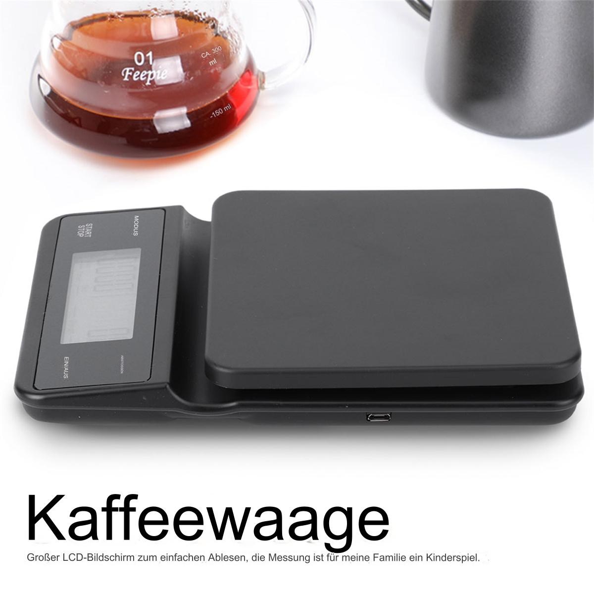 Schwarze Kaffeewaage mit Digitalanzeige und Glaskaraffe. Text auf Deutsch.