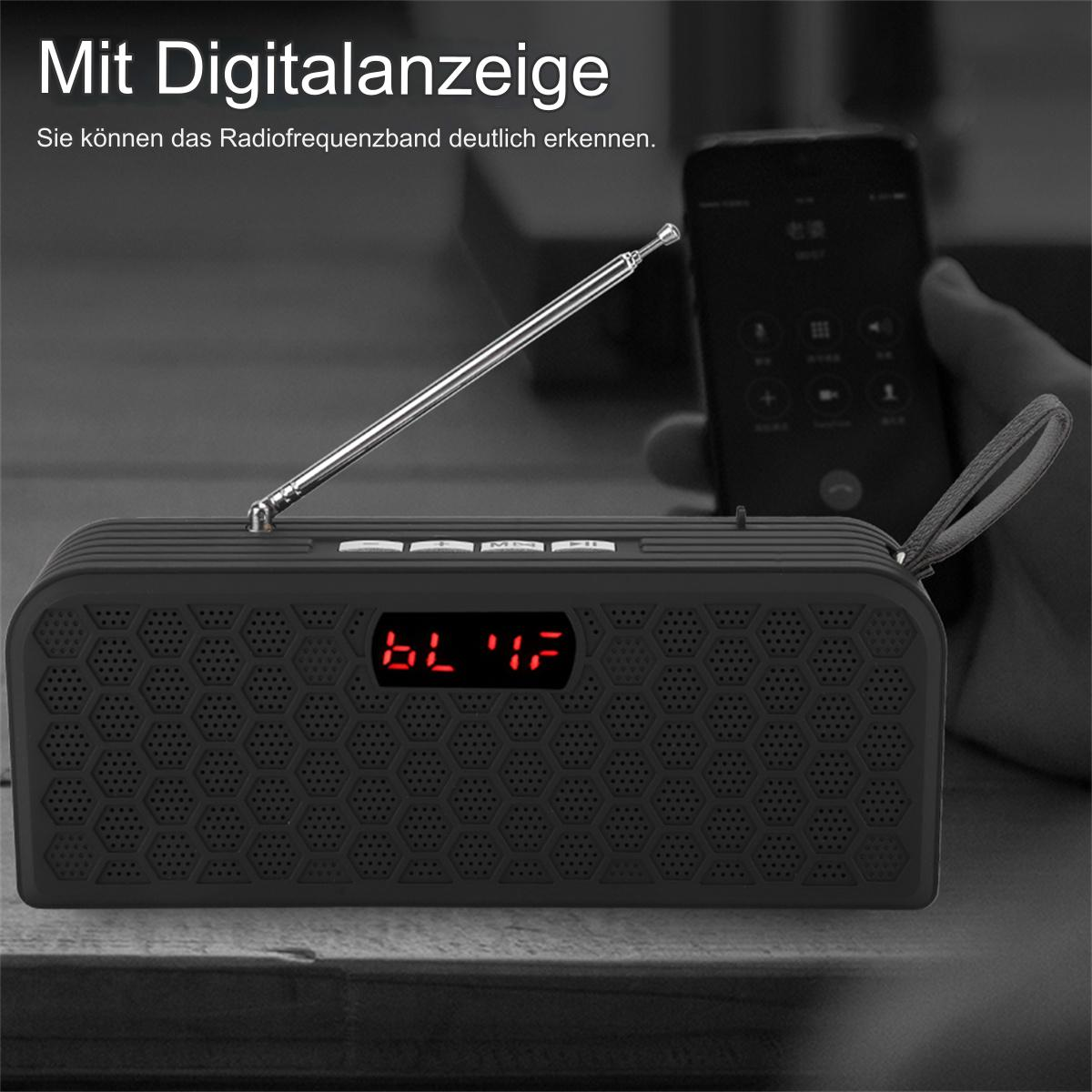 Schwarzes Radio mit digitaler Anzeige. Ein Telefon ist im Hintergrund unscharf.