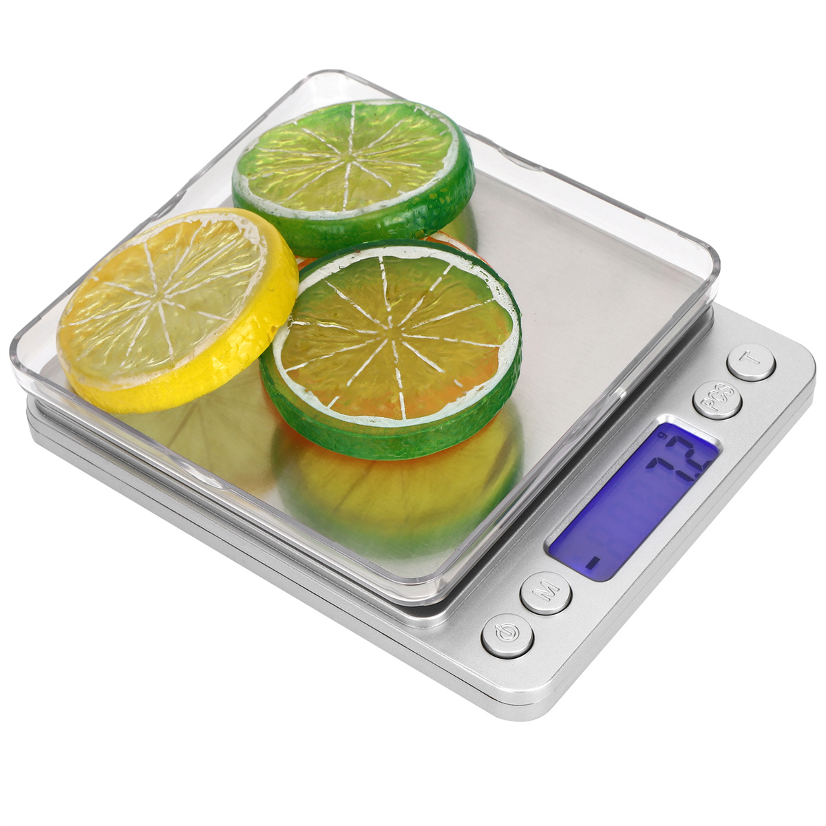 Eine Digitalwaage mit drei Fruchtscheiben: Zitrone, Limette und Orange. Die Anzeige zeigt 72.
