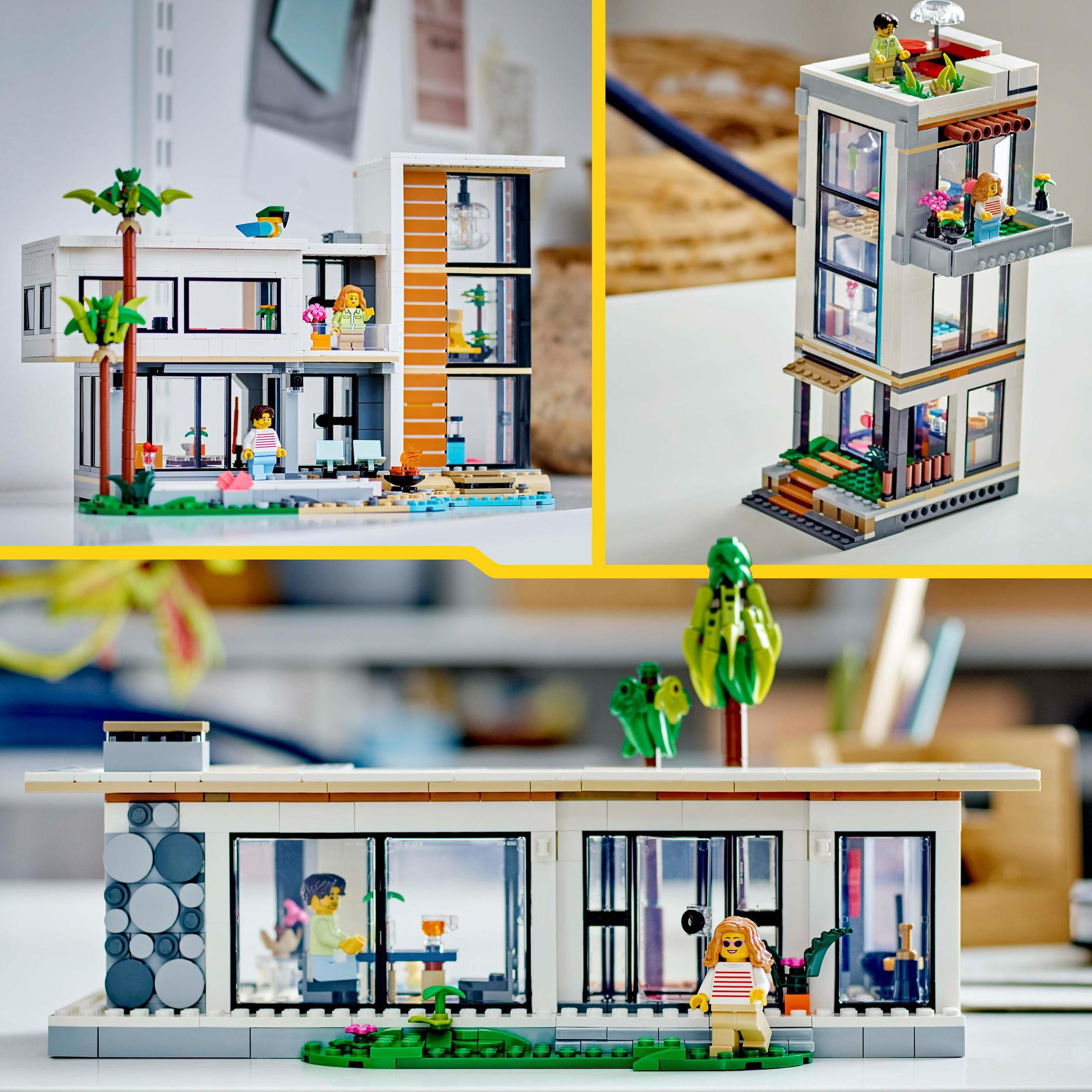 Çok katlı, cam duvarlı ve minyatür figürlü modern bir evin Lego modeli.