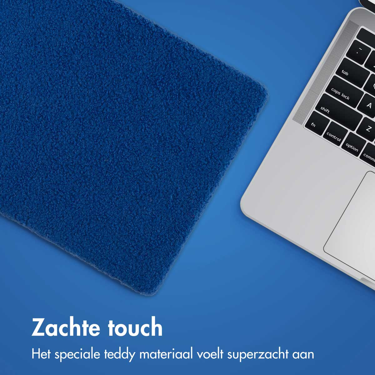 A blue, fluffy pad on a blue surface. A laptop is slightly visible in the background.