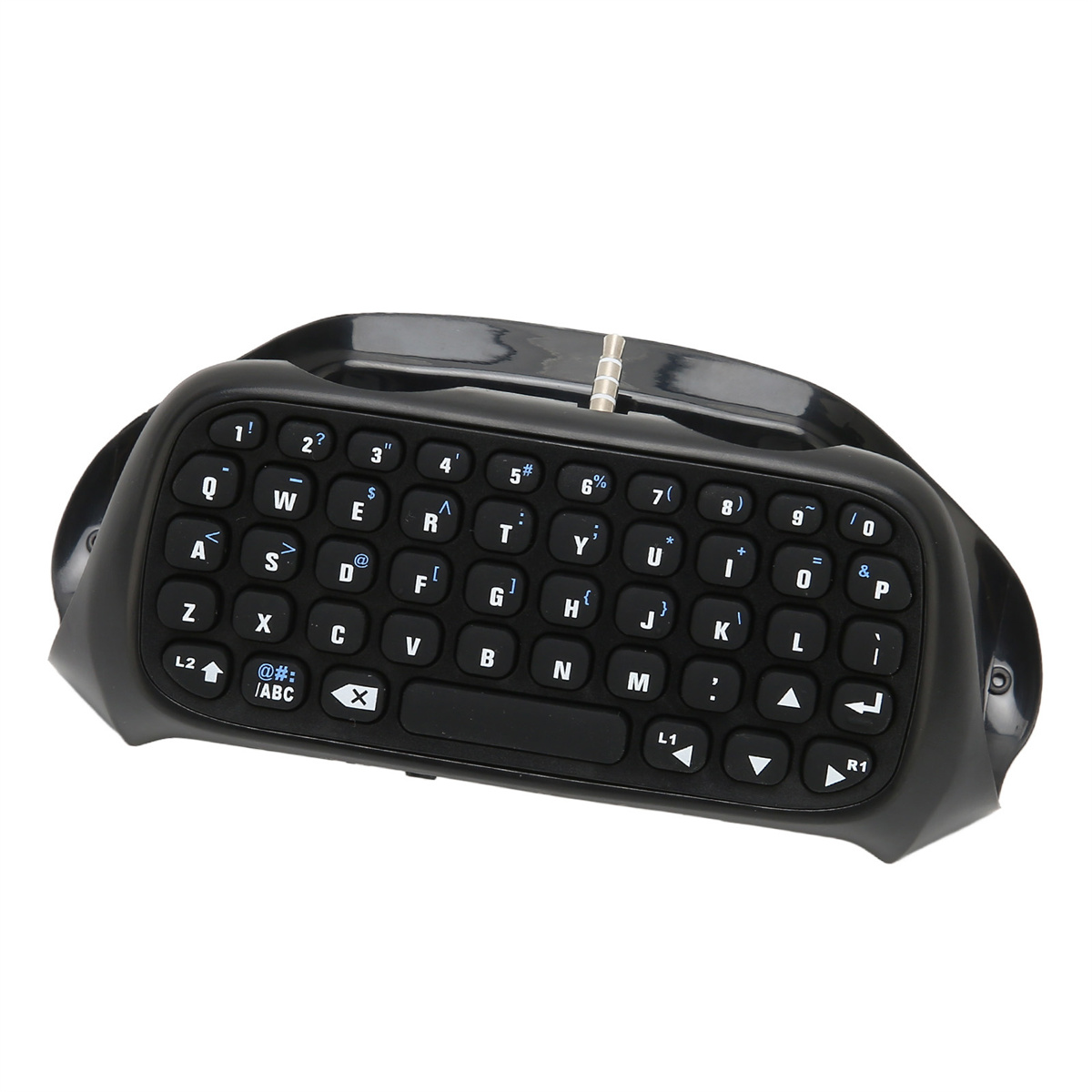 Schwarze Gamepad-Tastatur mit QWERTZ-Layout und Kopfhöreranschluss auf weißer Oberfläche.