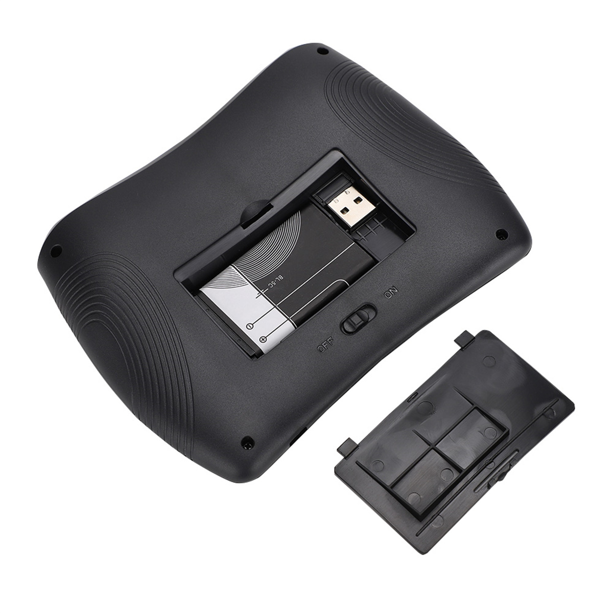 Schwarzes Gerät mit geöffnetem Batteriefach, das eine Batterie und den Schalter zeigt.