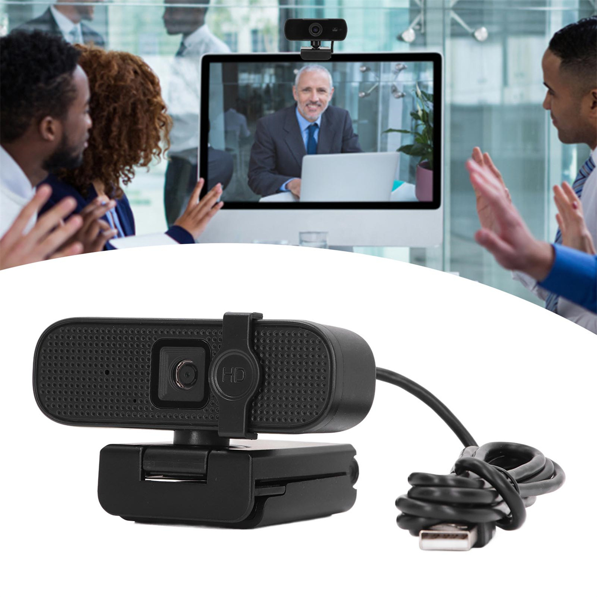 Schwarze Webcam mit Kabel, über einem Computerbildschirm mit einem Meeting positioniert.