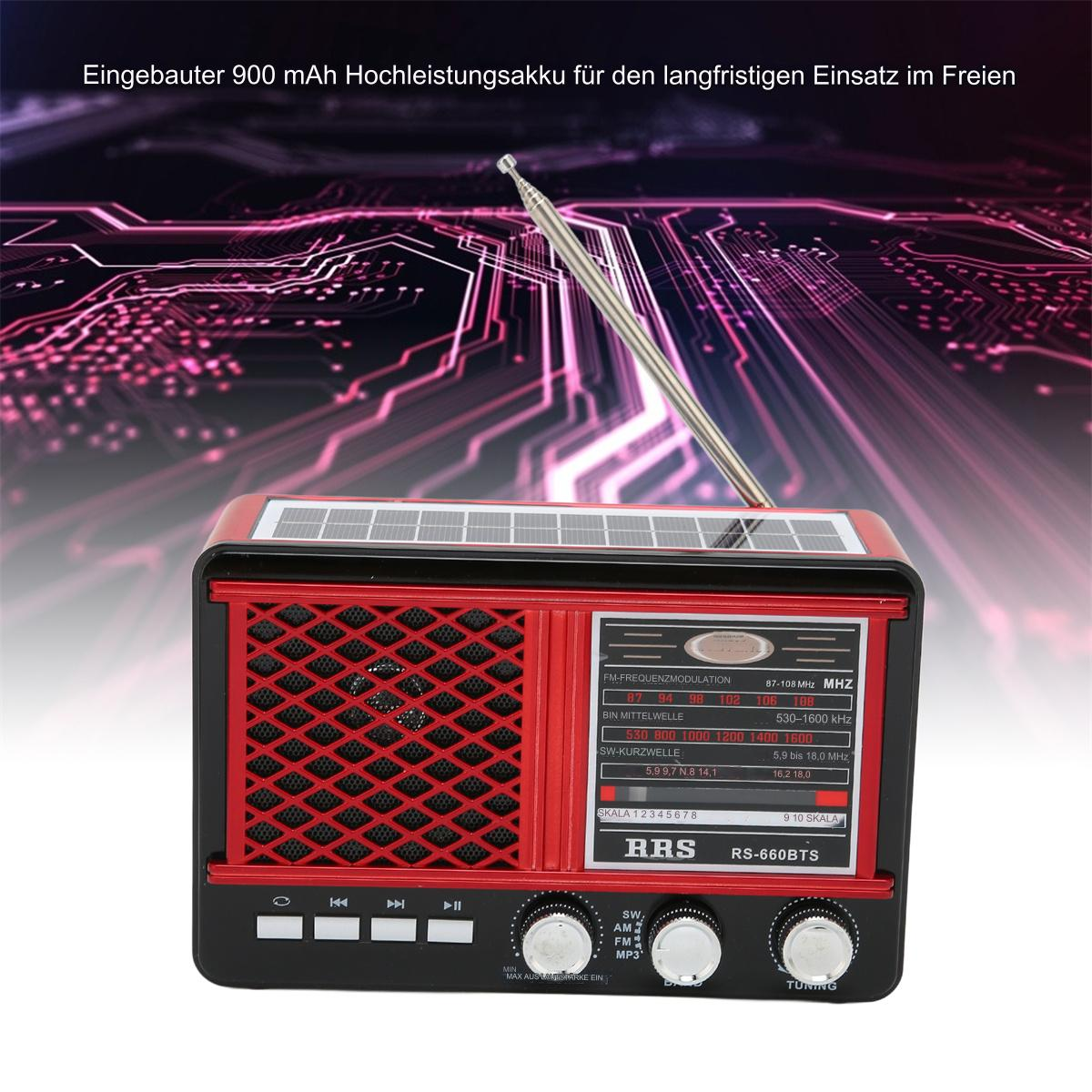 Rotes und schwarzes Radio mit Solarpanel und Antenne, auf Tisch.