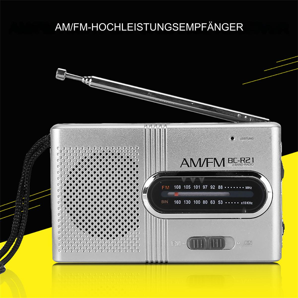 Silbernes AM/FM-Radio mit einem Drehrad. Text: AM/FM-HOCHLEISTUNGSEMPFÄNGER.