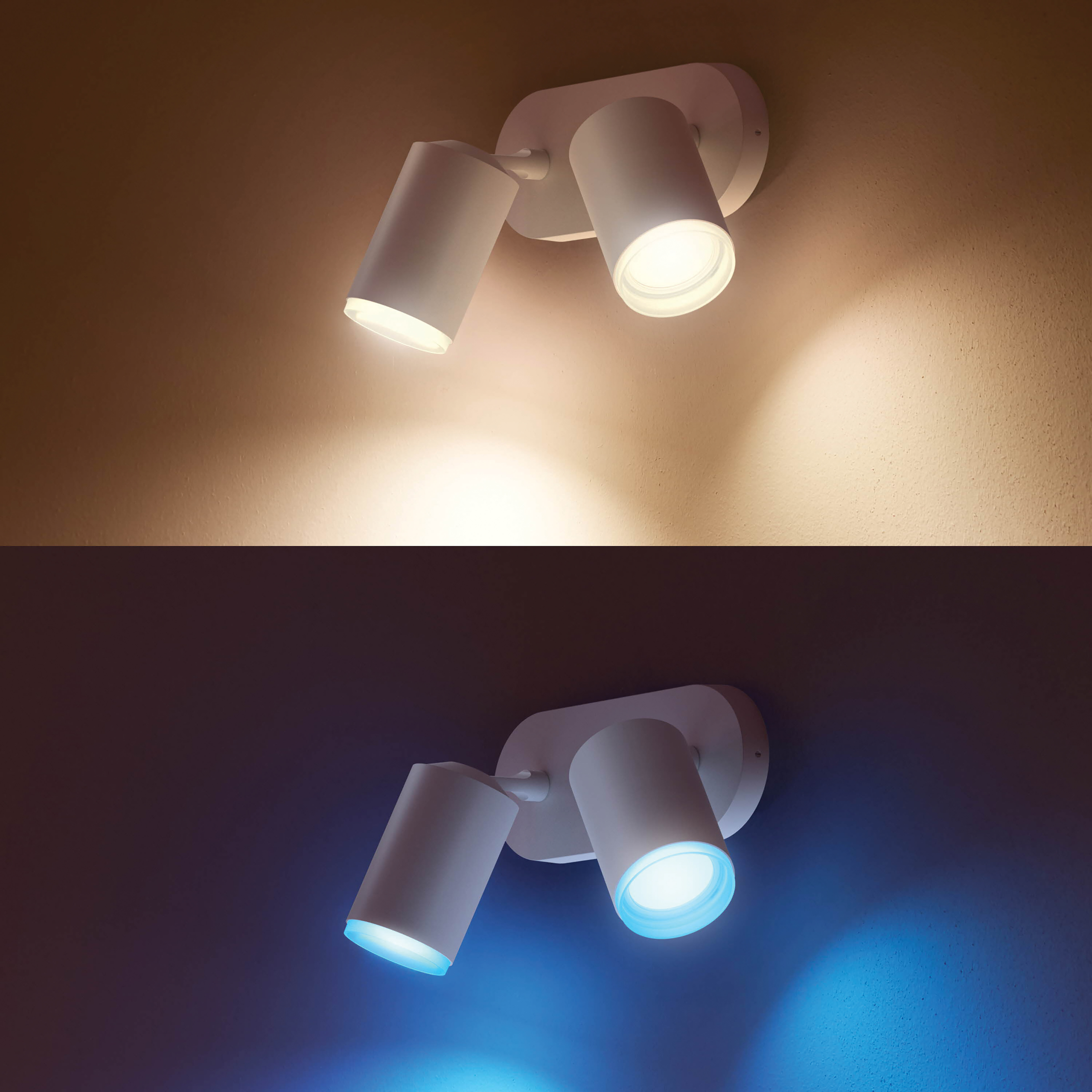 Twee witte spots op een muur, één verlicht met warm licht, de ander met koel licht.