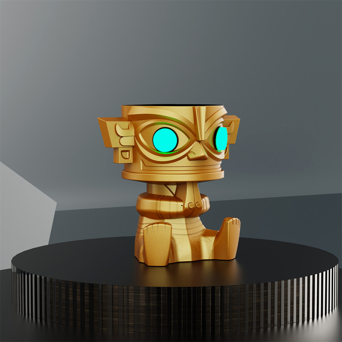 Eine goldene Statue mit leuchtend blauen Augen. Sie hat einen großen Kopf und sitzt auf einem schwarzen Sockel.