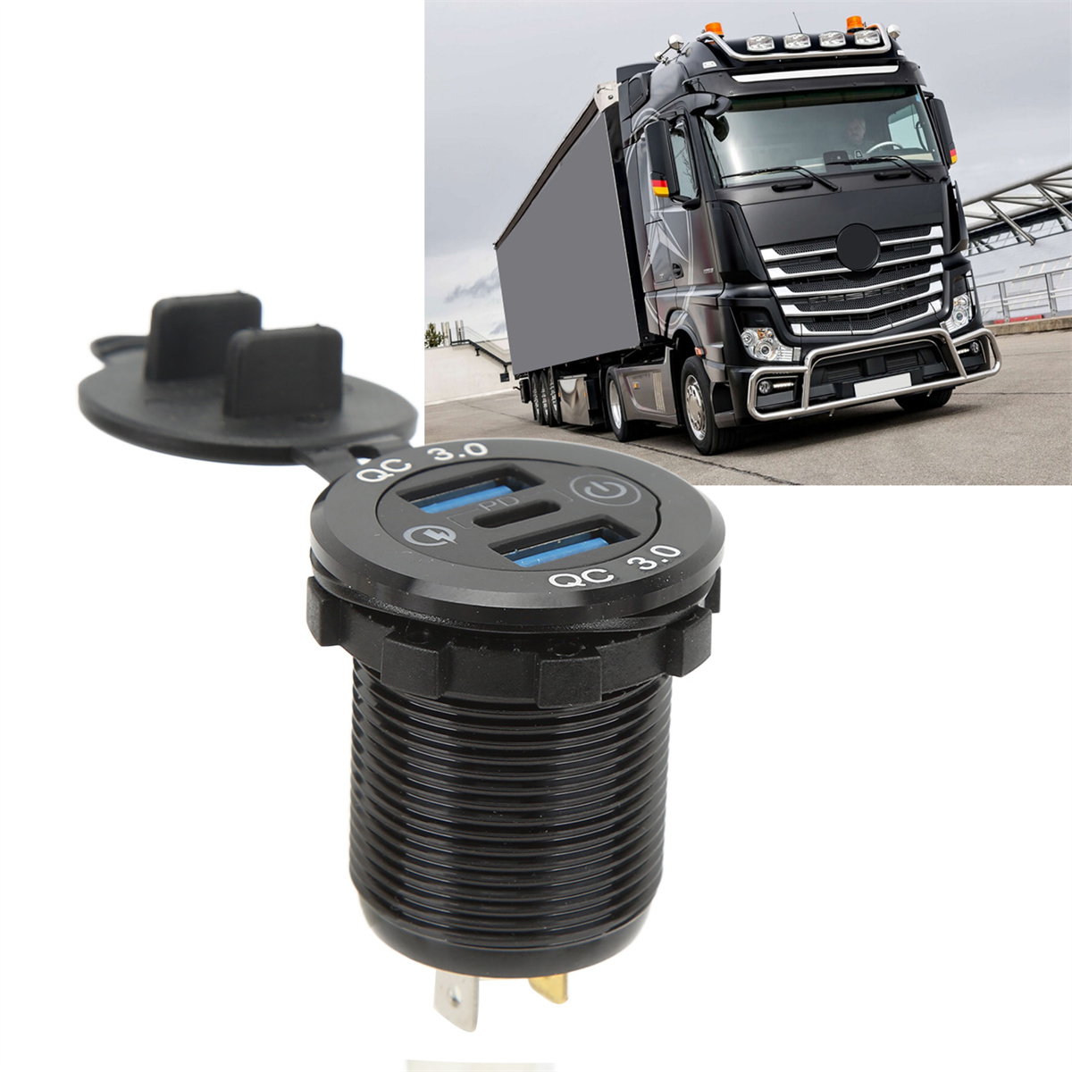 Schwarzer USB-Ladeanschluss für LKW mit LKW im Hintergrund.