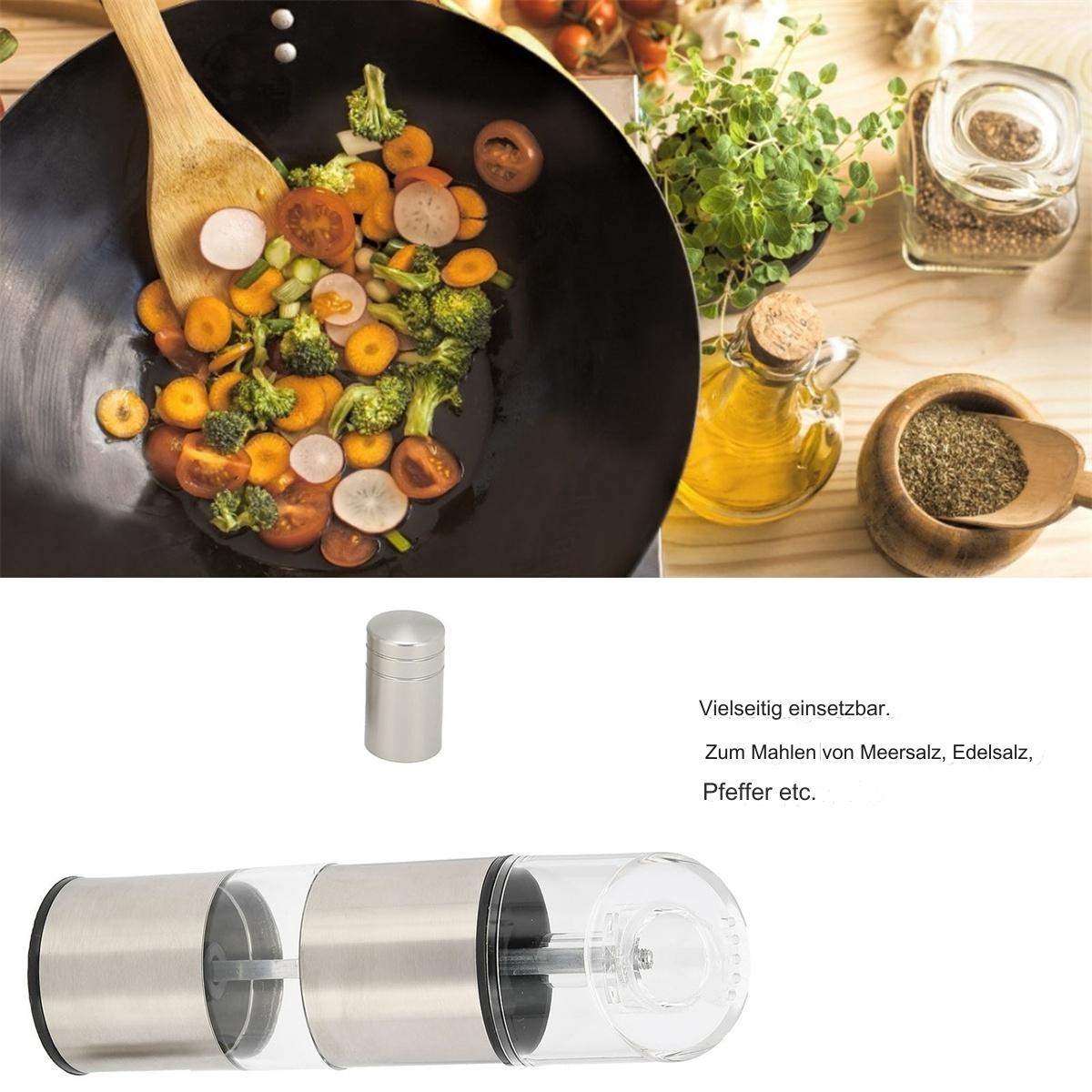 Zubereitung von Speisen mit Gemüse im Wok und einer Gewürzmühle. Zutaten auf einem Tisch.
