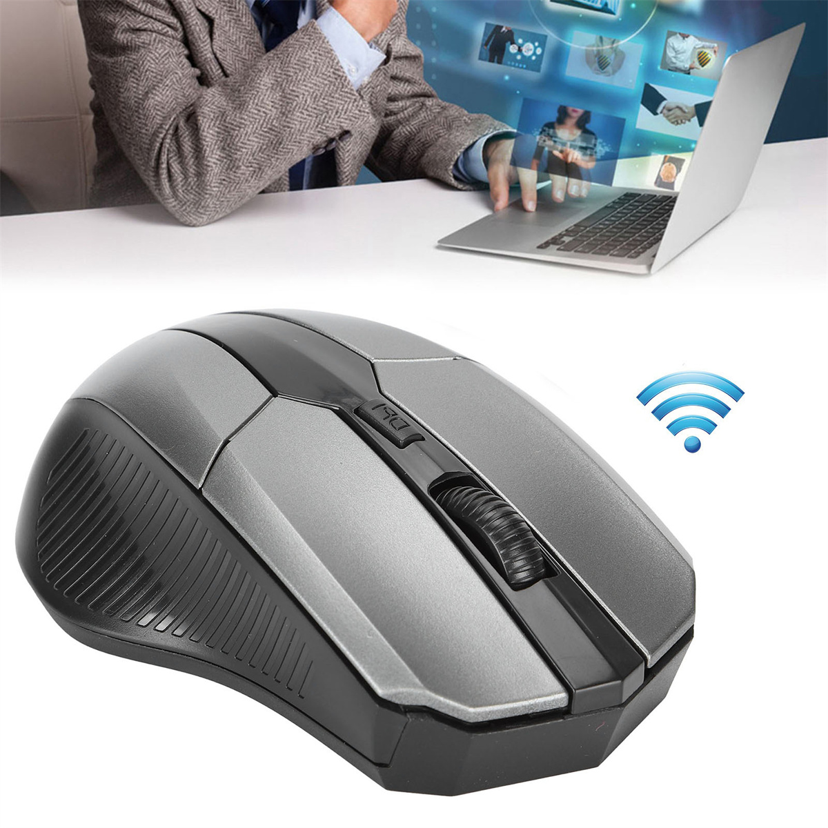 Kabellose graue Maus mit Person, die im Hintergrund einen Laptop benutzt. WLAN-Symbol.