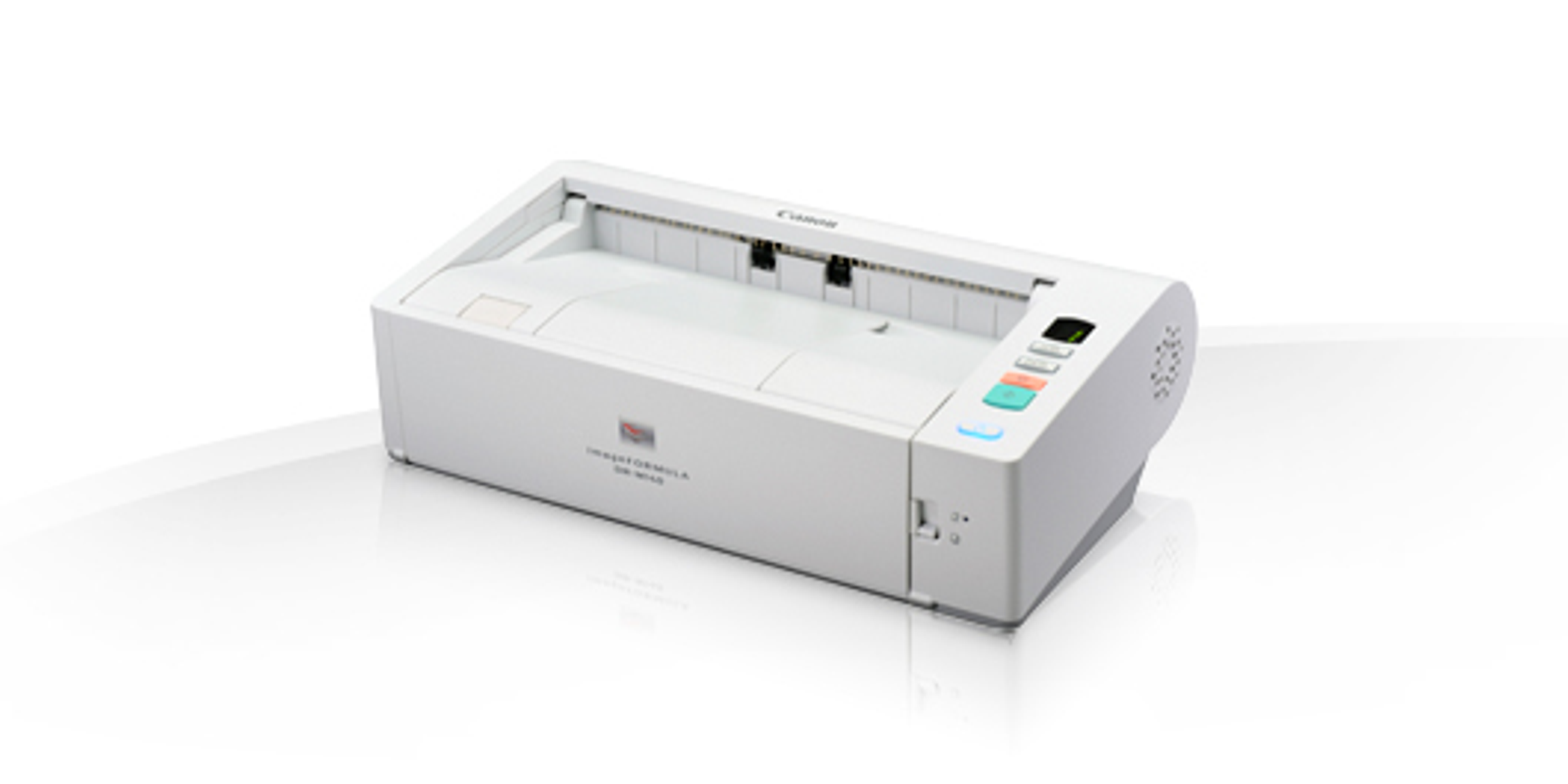 Scanner Canon bianco e grigio su superficie bianca.