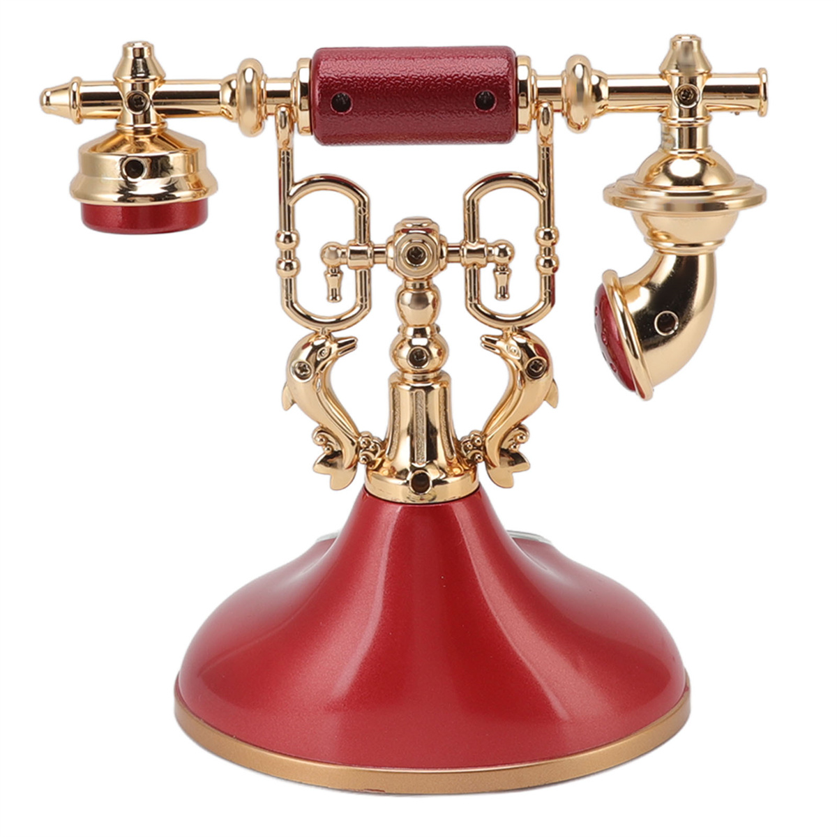 Vintage rotes und goldenes Telefon. Verfügt über einen roten Hörer und eine goldene Basis.