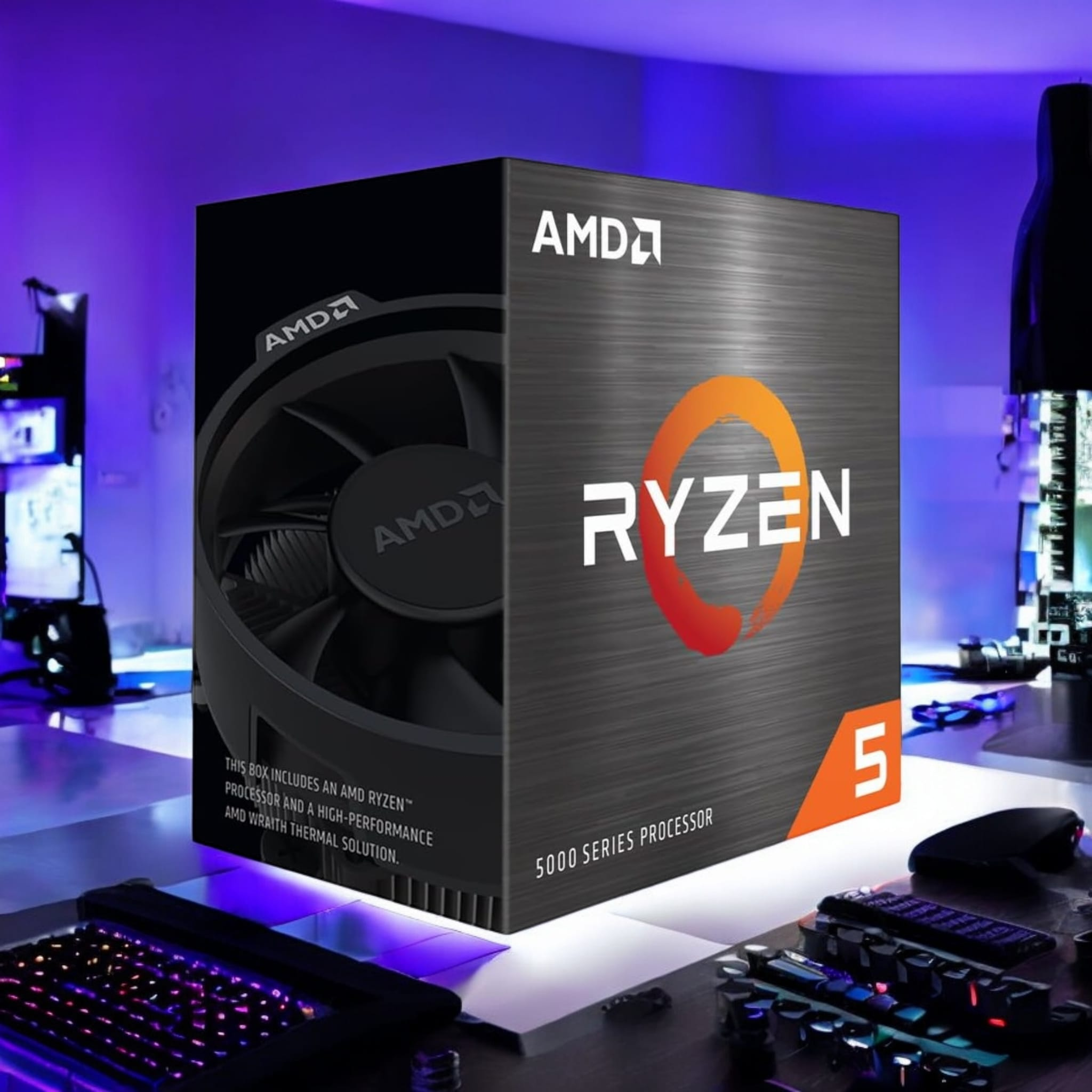 Una caja del procesador AMD Ryzen 5 en una mesa con teclado y ratón, e iluminación de neón.