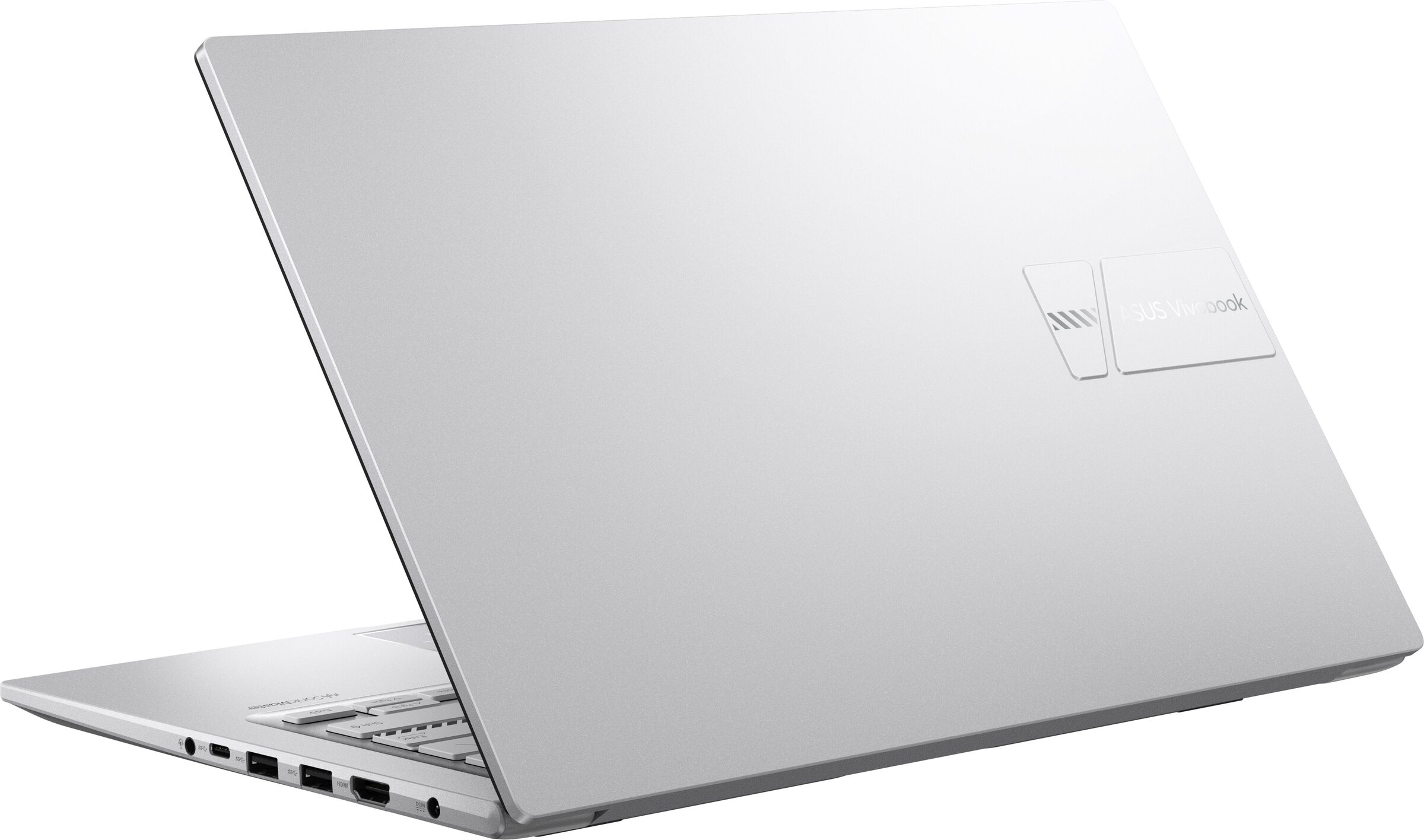 Una laptop plateada, ligeramente abierta, mostrando la parte trasera. El logotipo de ASUS Vivobook es visible en la esquina superior derecha.