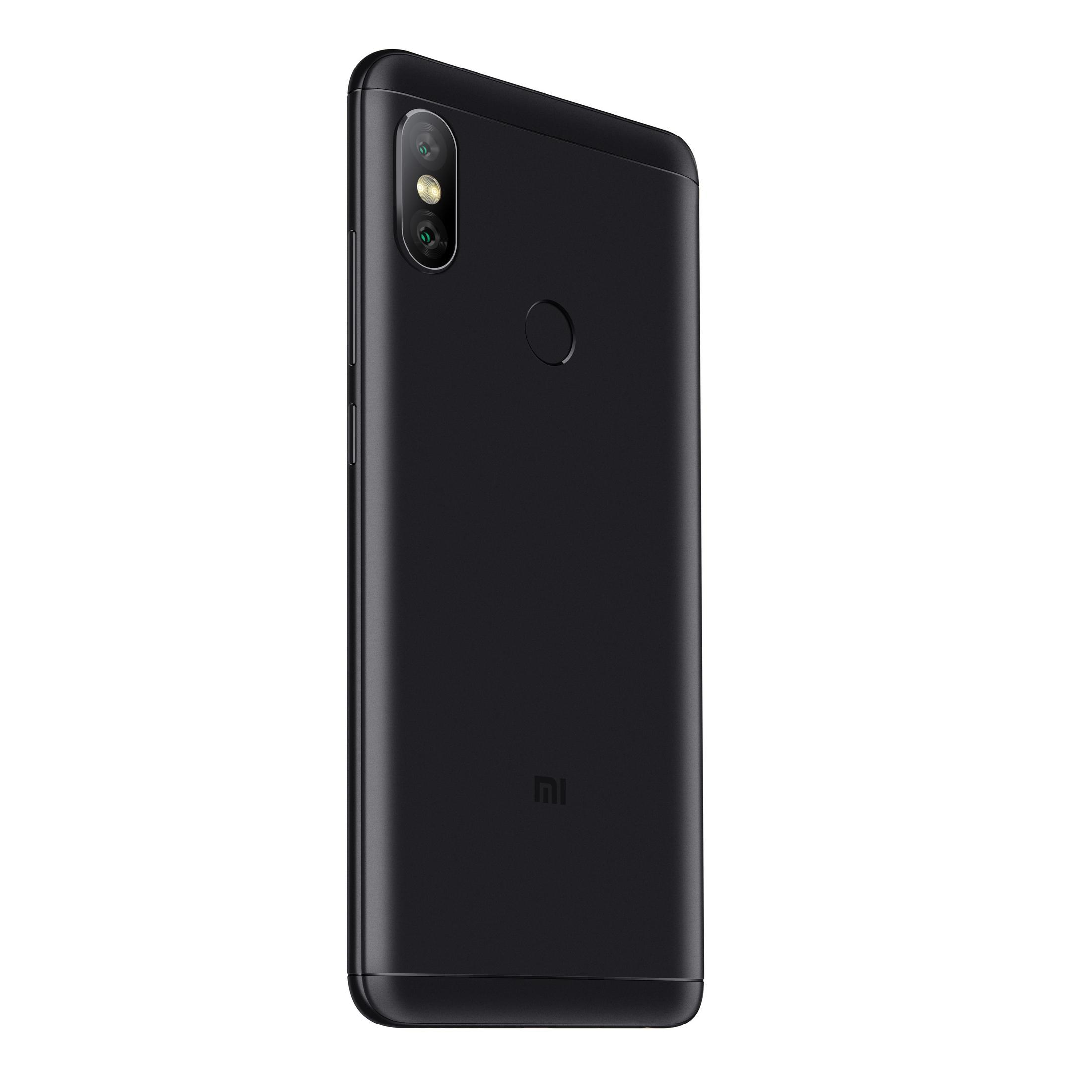 Un telefono Xiaomi nero, vista posteriore, con fotocamera e sensore di impronte digitali.