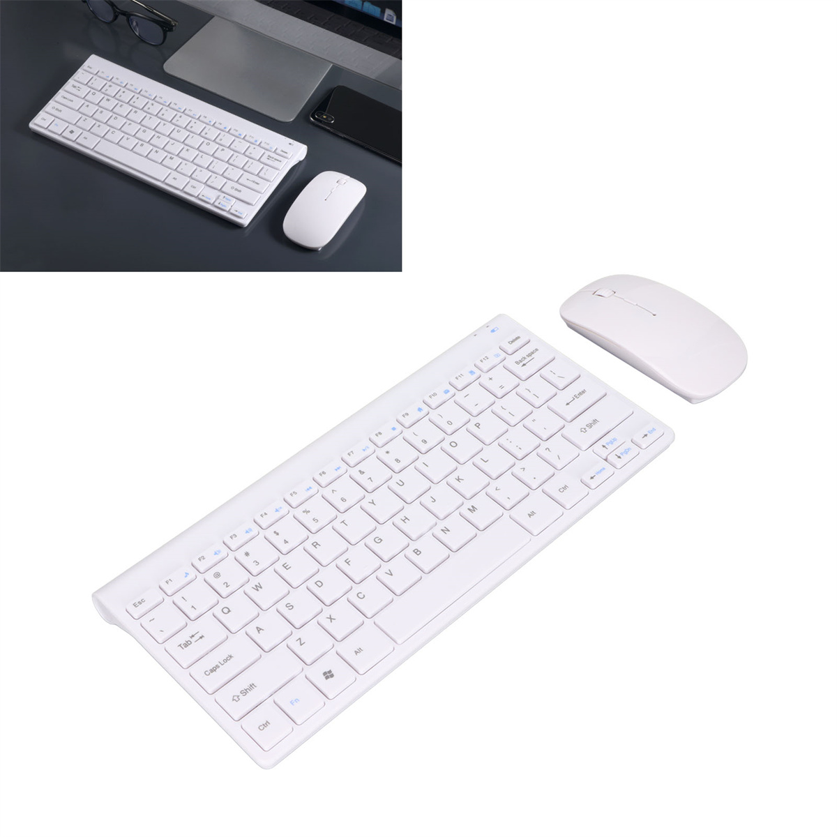 Weiße kabellose Tastatur und Maus auf einem Schreibtisch. Eine weitere Tastatur und Maus sind im Hintergrund unscharf.
