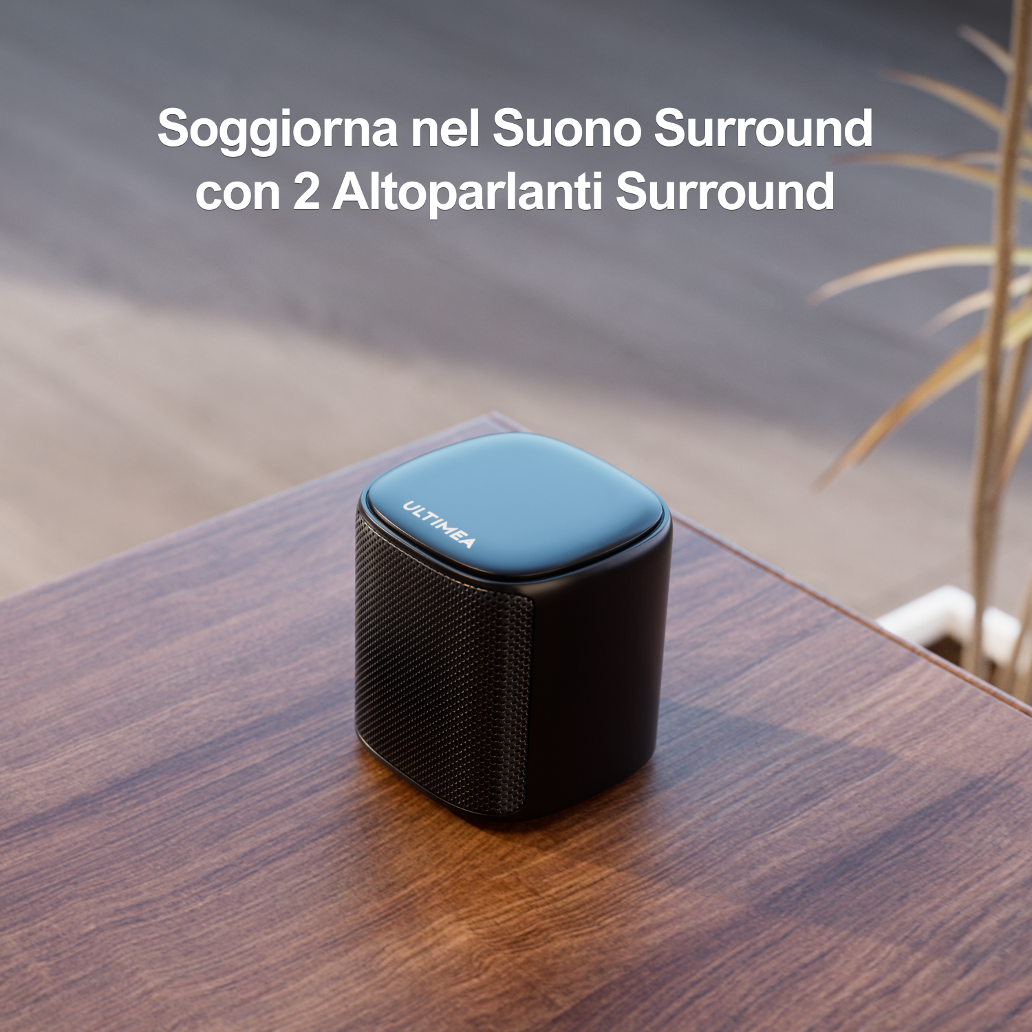 Altoparlante nero su tavolo di legno. Testo in italiano: 