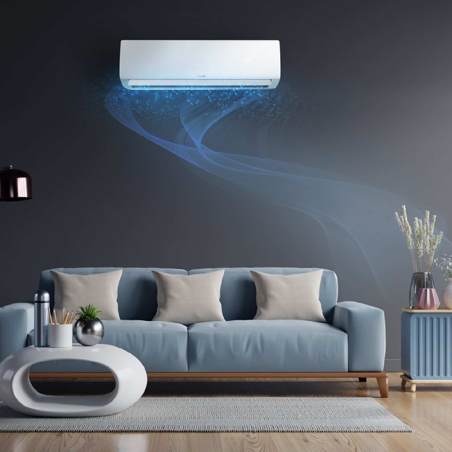 Salón moderno con sofá azul y aire acondicionado. También se ven una mesa blanca y una lámpara.