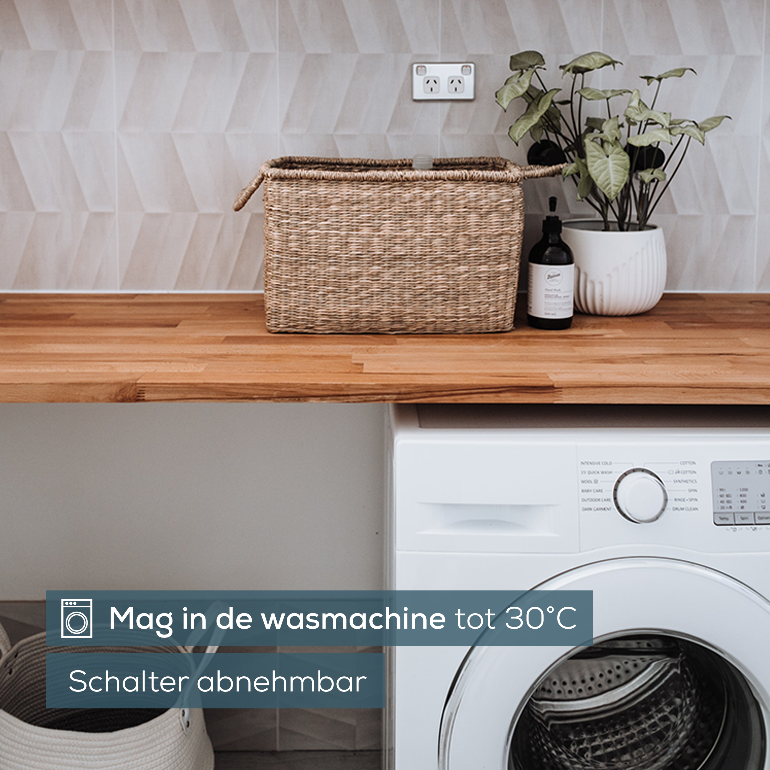Laundry room: washing machine, wicker basket, plants.