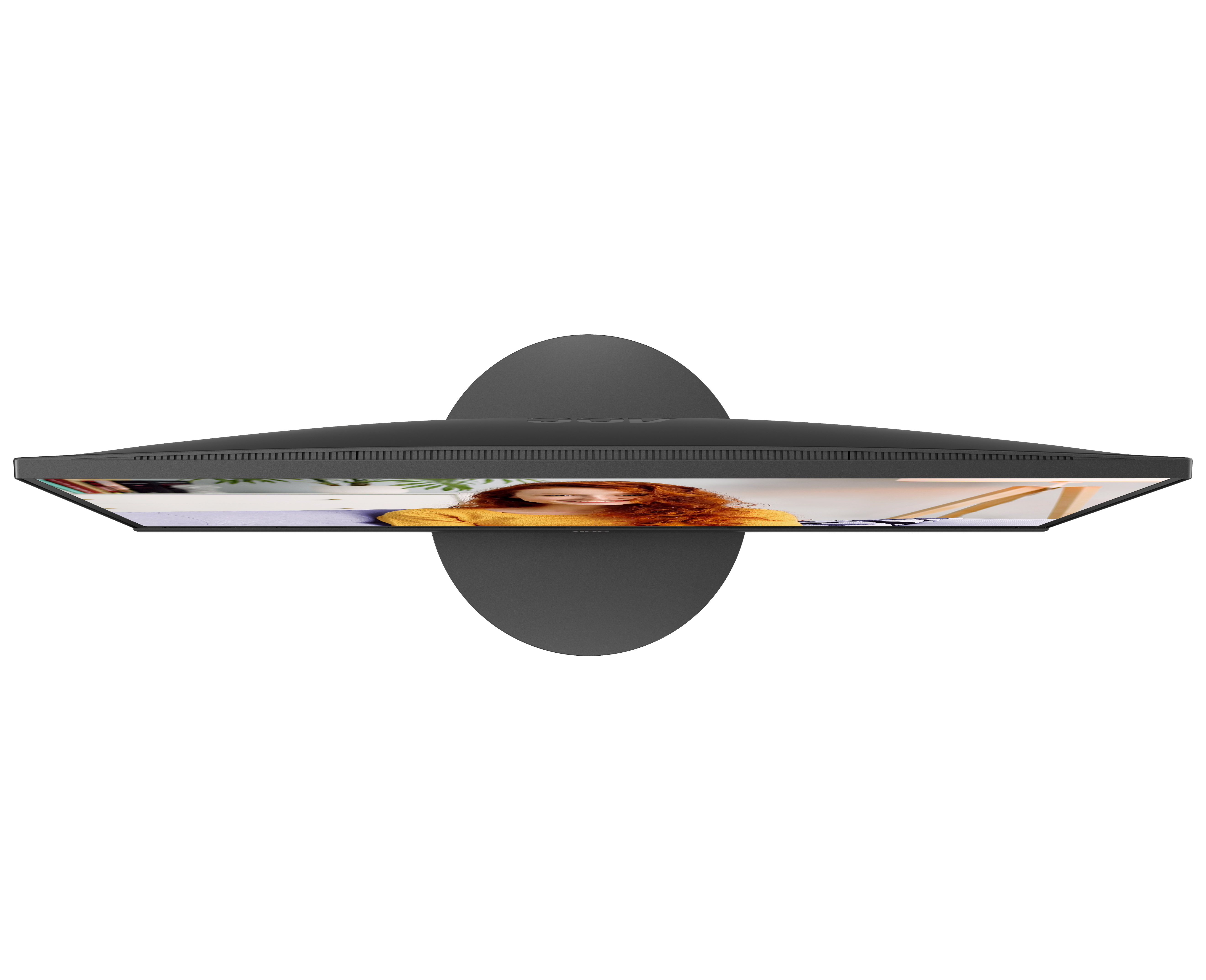 Widok z góry na czarny monitor komputera. Ekran pokazuje kobietę.