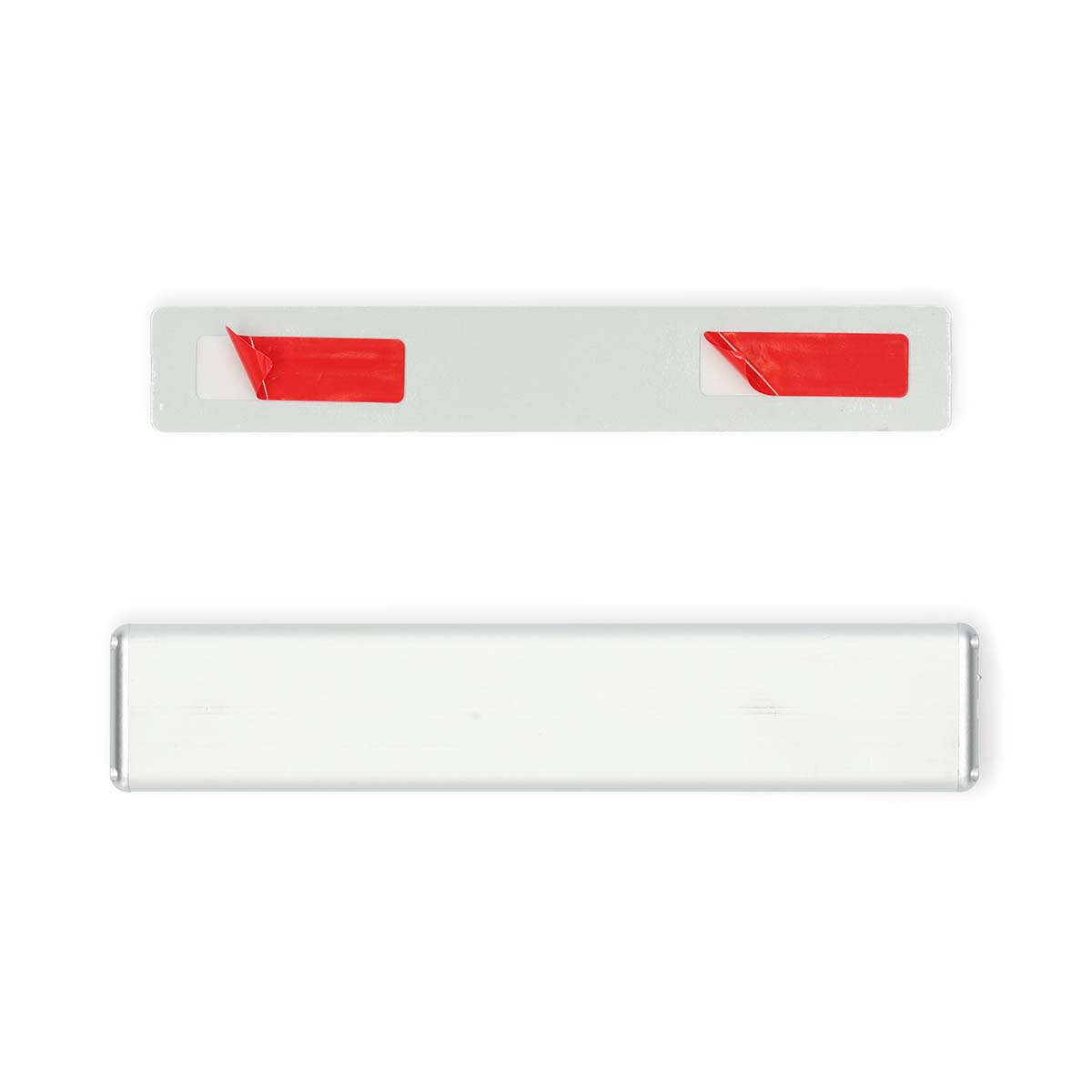 Two white rectangular objects with red tape on them. White background.