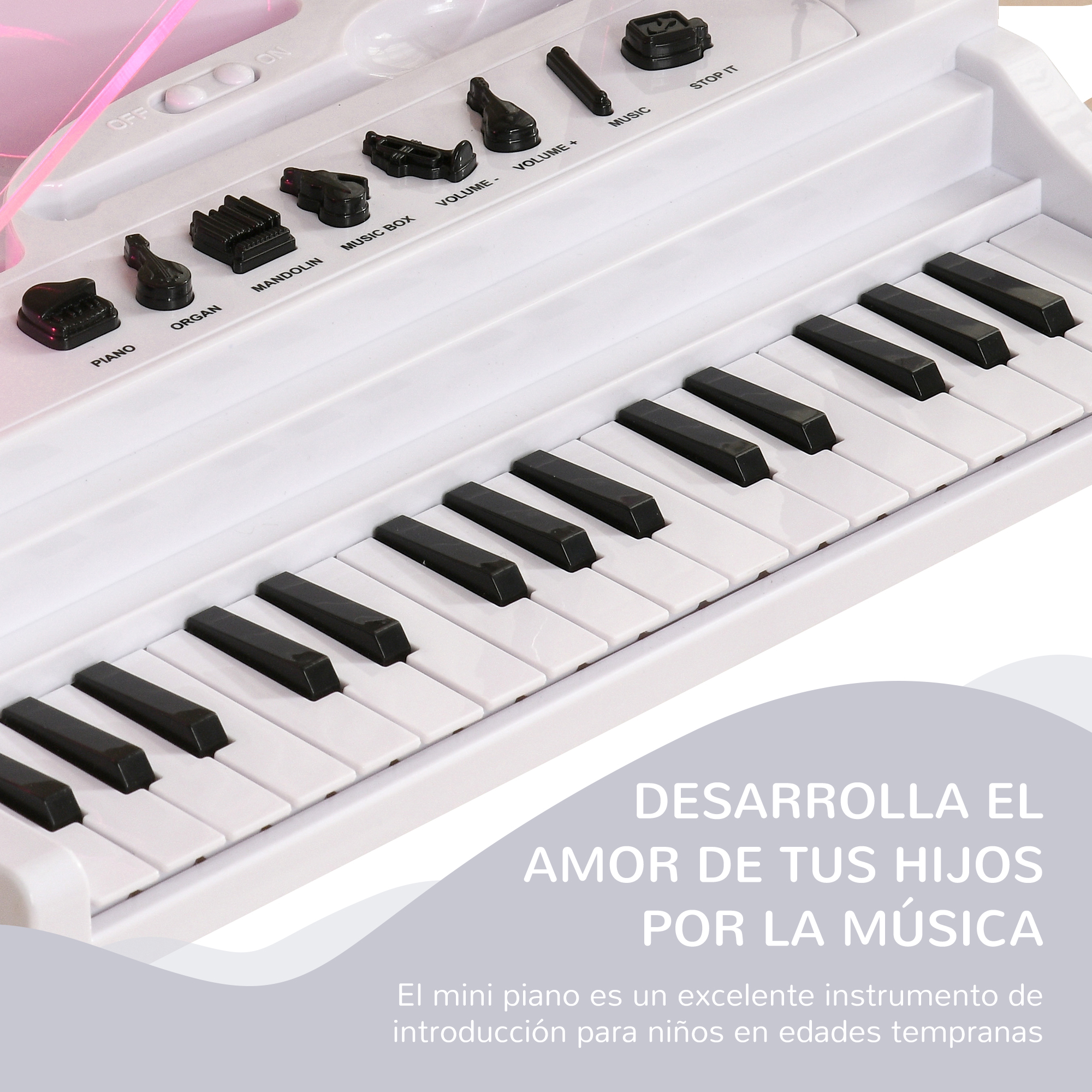 Un piano de juguete blanco con teclas negras. El texto dice: 'Desarrolla el amor de tus hijos por la música'.