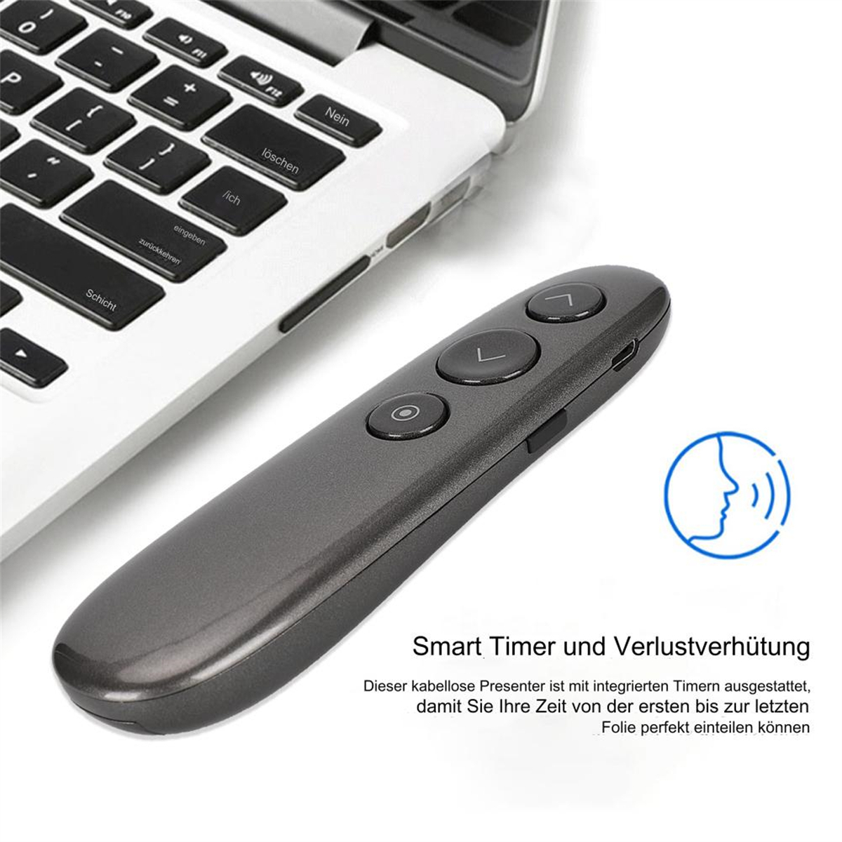 Eine graue Präsentationsfernbedienung mit Knöpfen und Text, in der Nähe eines Laptops.