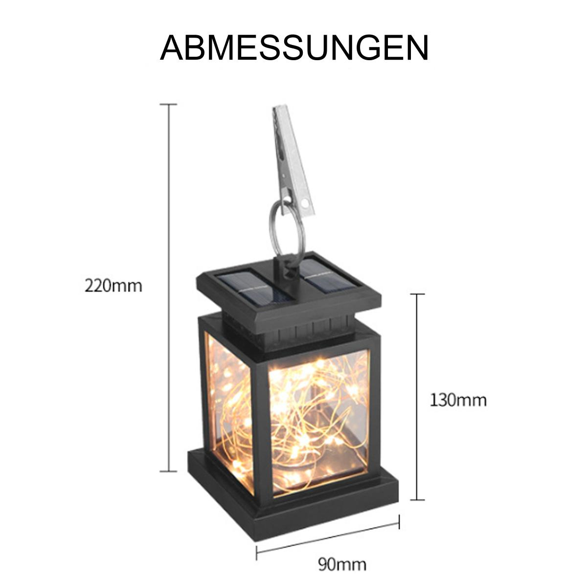 Eine schwarze Solar-Laterne mit klaren Seiten, die Lichterketten zeigen. Abmessungen von 220x90x130mm.