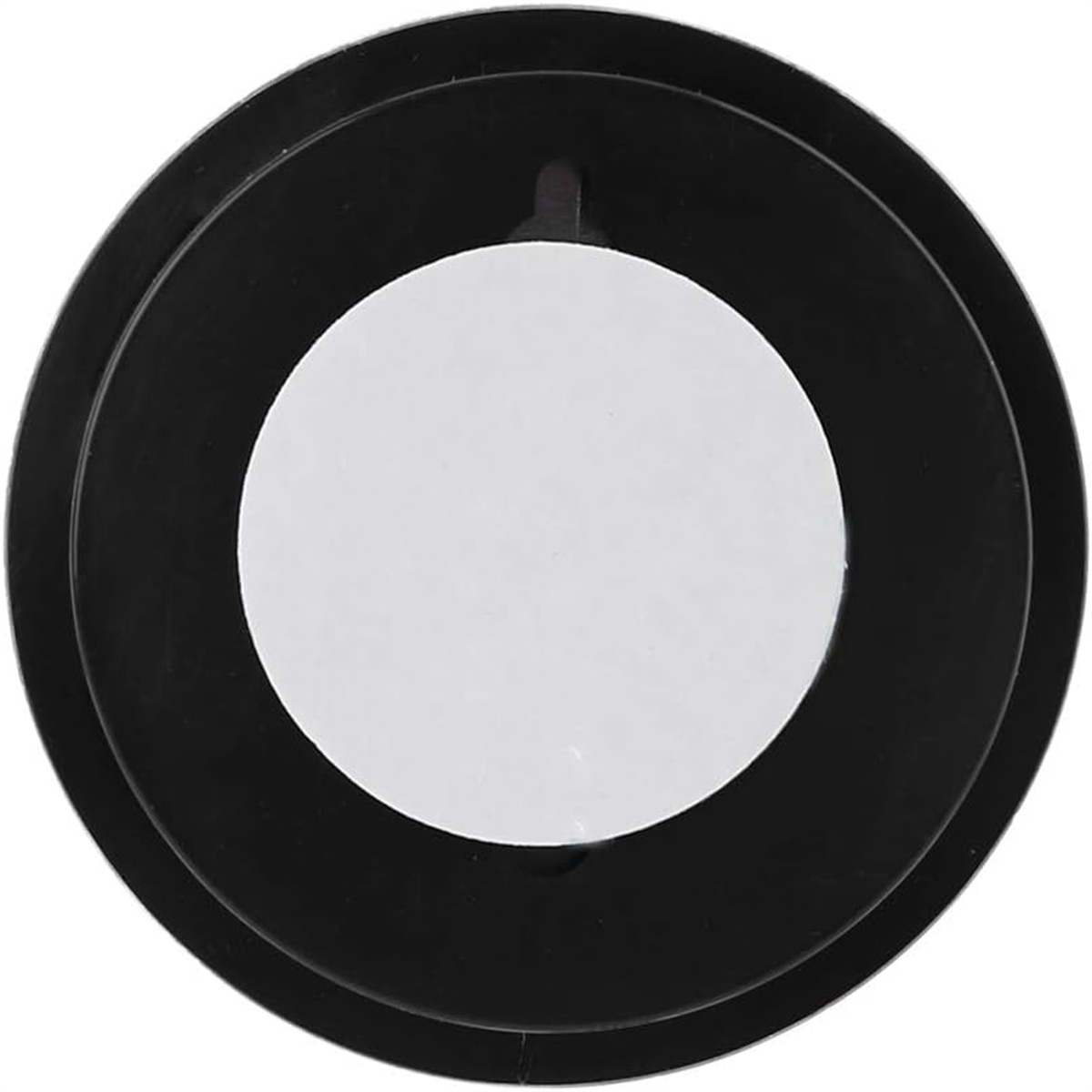 Ein schwarzes rundes Objekt mit einem weißen Kreis in der Mitte. Zur Wandmontage.