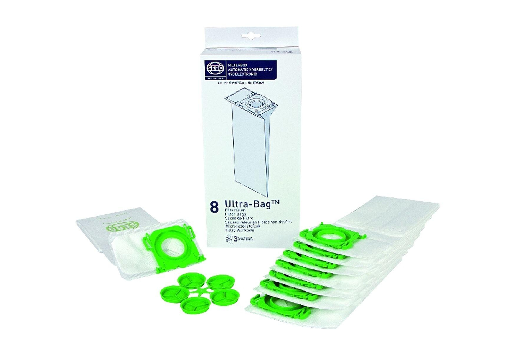 Staubsaugerbeutel und Filterbeutelpackung, weiß mit grünen Akzenten, isoliert.