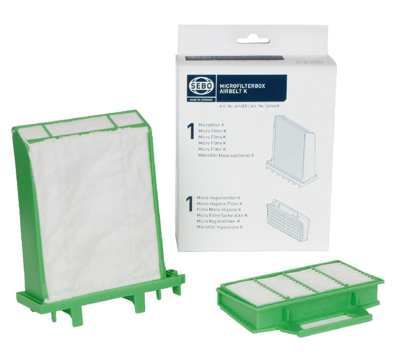 Zwei grüne und weiße Luftfilter mit einer Box. Filter haben grüne Rahmen und weißes Filtermaterial.