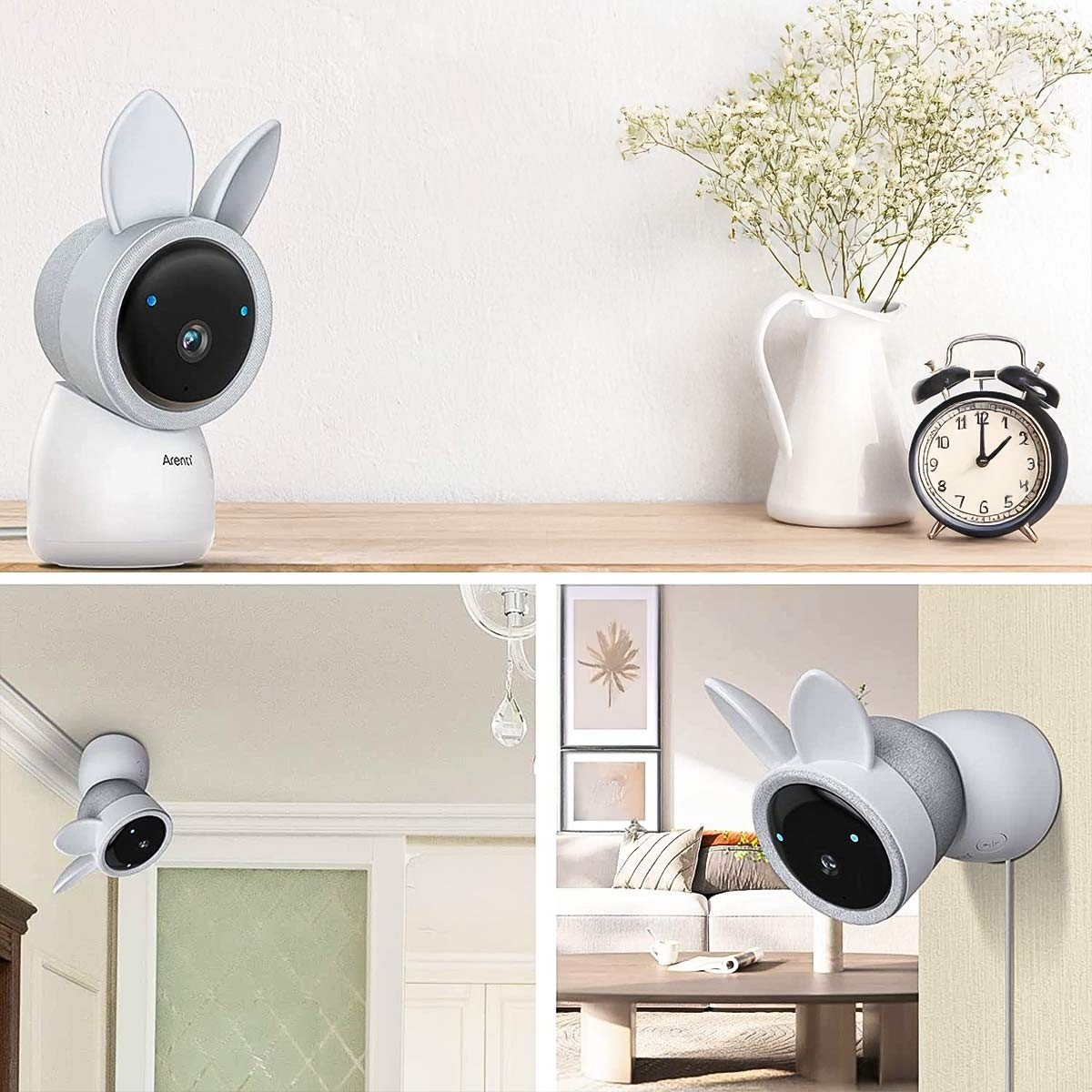 Weißer, hasenförmiger Baby-Monitor auf einem Regal mit Blumen und einer Uhr und an einer Wand montiert.