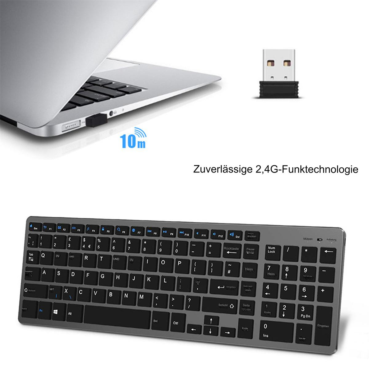 Ein silberner Laptop neben einer kabellosen Tastatur und einem USB-Empfänger. Die Tastatur ist schwarz mit weißen Buchstaben.
