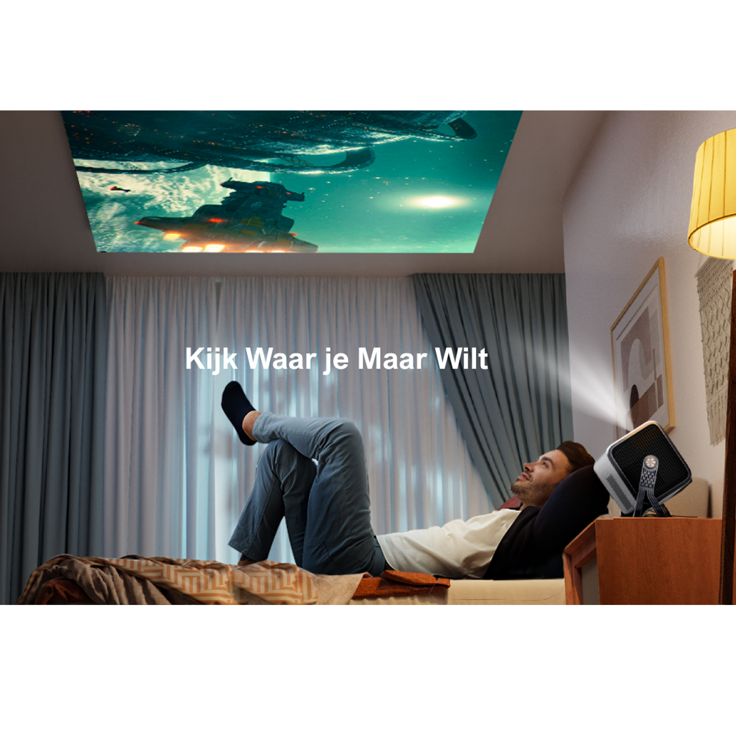 Man lying on bed looking at a projected image on the ceiling.
