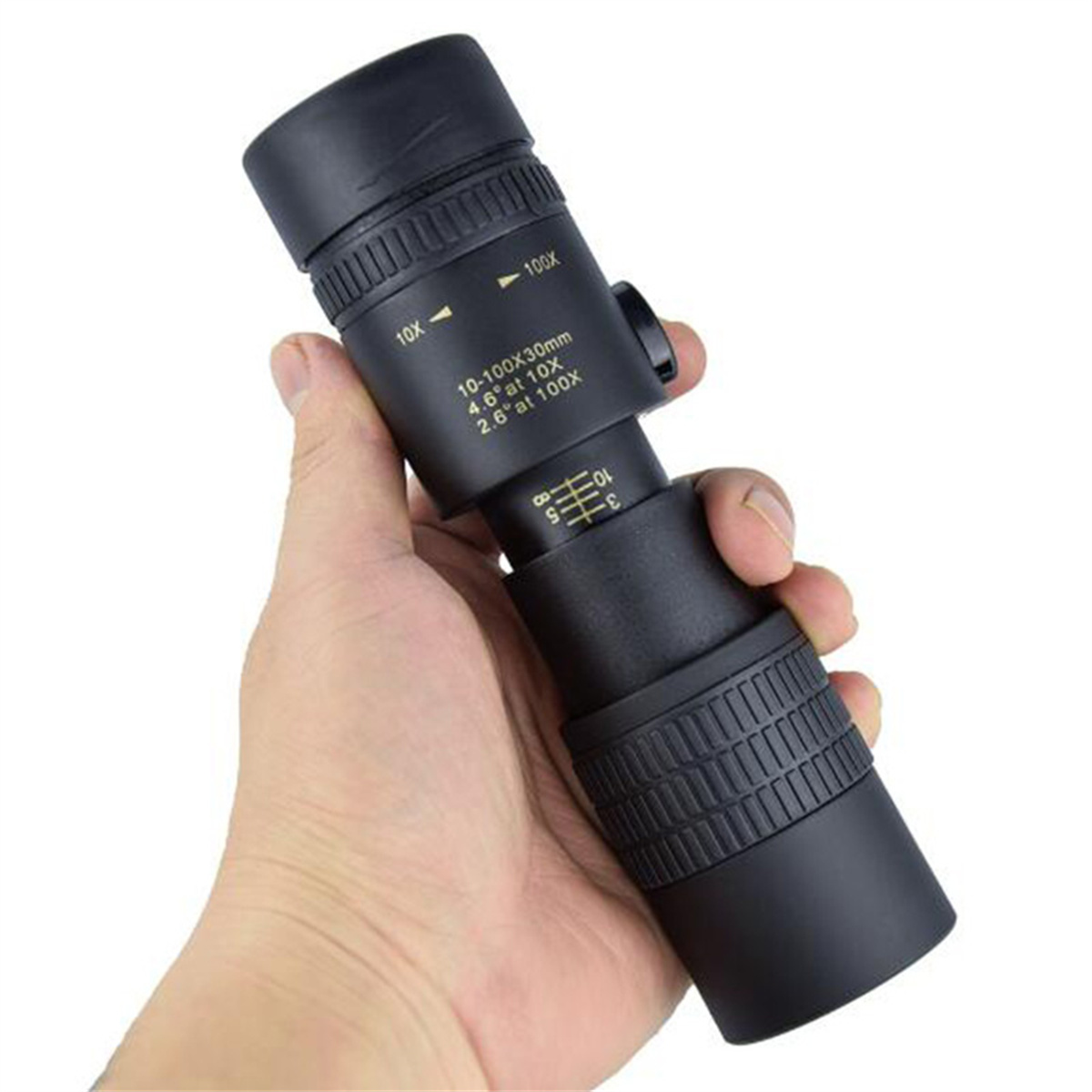 Ein Monokular-Teleskop in der Hand, mit Fokusring, schwarzes Gehäuse.