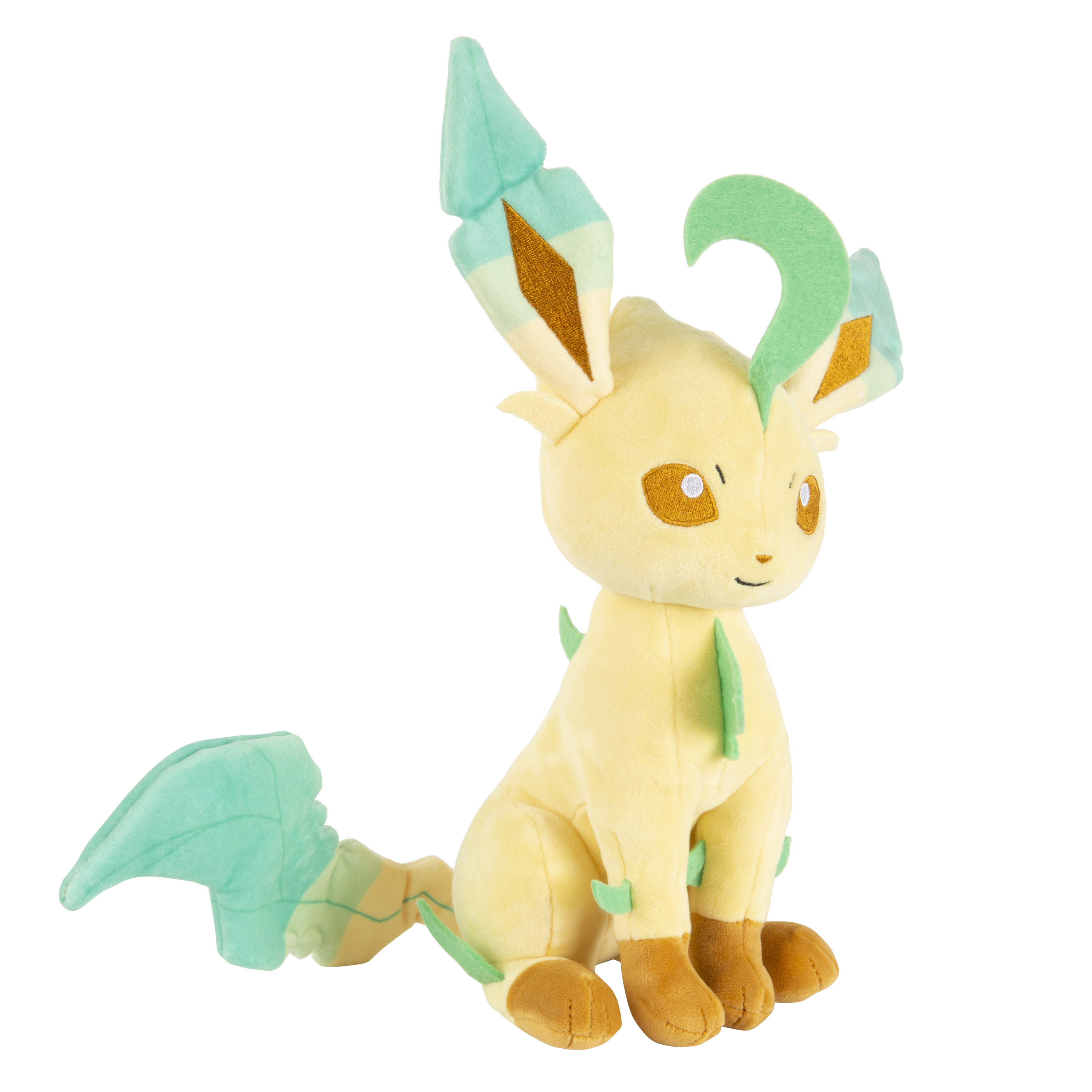 Ein sitzendes Plüschtier des Pokémon-Charakters Leafeon, mit gelben und grünen Farben.