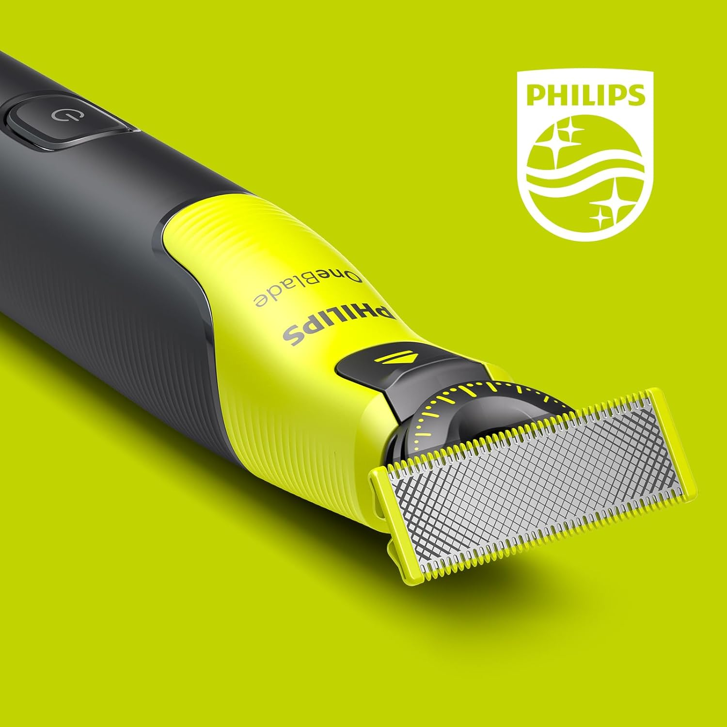 Golarka Philips OneBlade w kolorze żółtym i czarnym na zielonym tle.