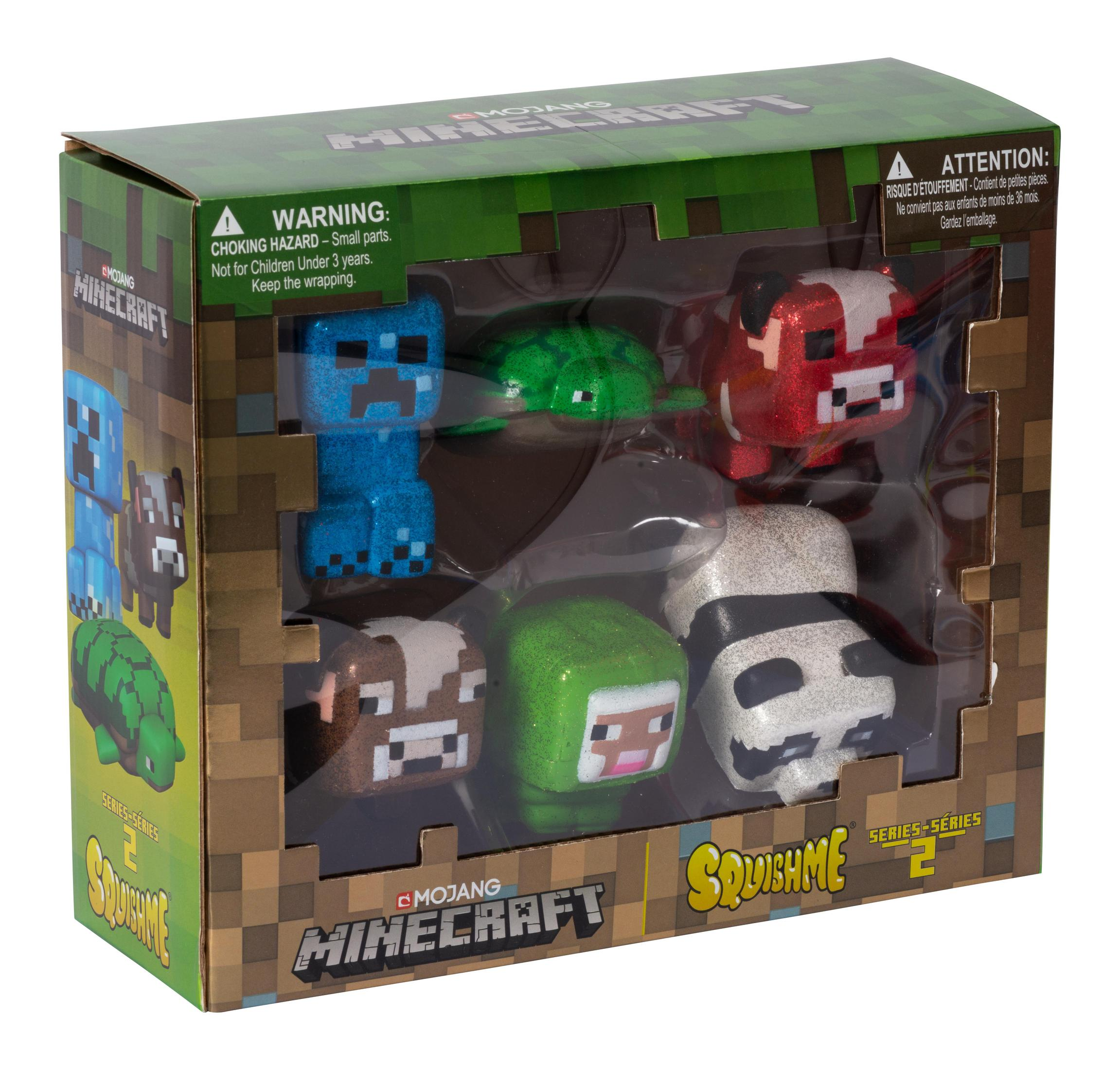 Minecraft-Spielzeugset mit verschiedenen Charakteren in einer Box, einschließlich eines Creepers und eines Schweins.